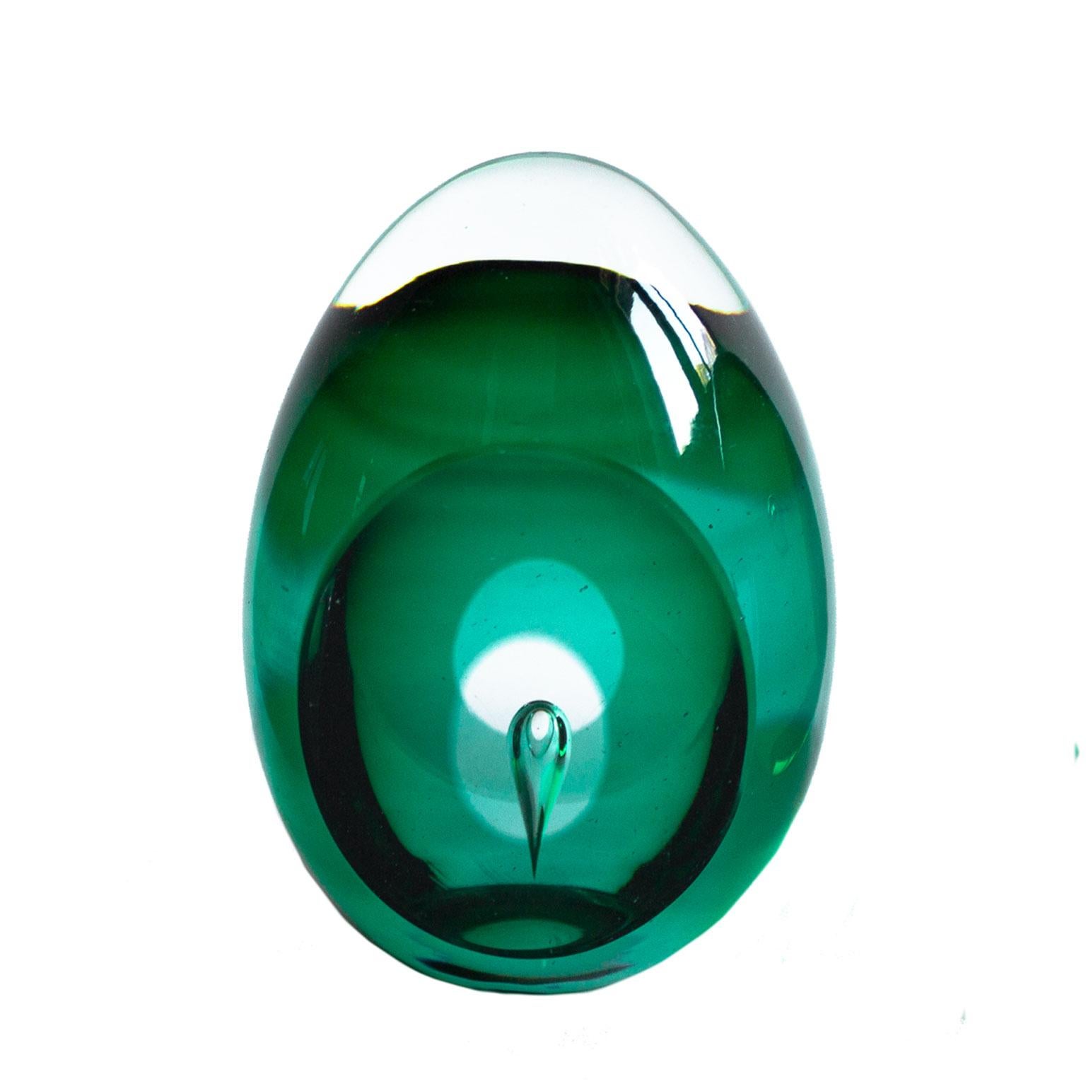 Scandinavian Modern glass sculpture signed by Mona Morales-Schildt for Kosta. Two green paperweights/sculptures. Both with a bubble in the middle. The inspiration comes from Paolo Veninis bright colors.
Morales has also been working as an ceramist