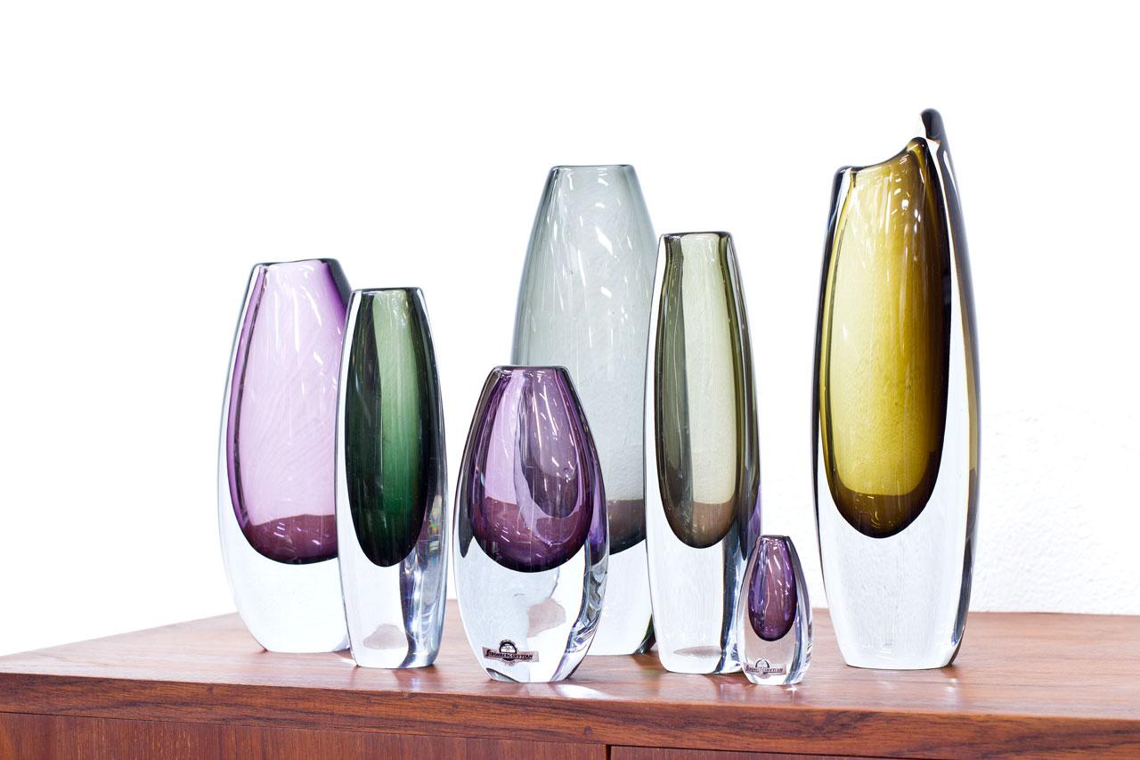 Group of 7 “Sommerso” vases. Designed by Gunnar Nylund and Asta Strömberg. Manufactured by Strömbergshyttan in Sweden during the 1950s. Coloured glass cased in clear technique. All vases are signed.

Dimensions: H 7 to 27 x W 3.5 to 10 x D 2.5 to