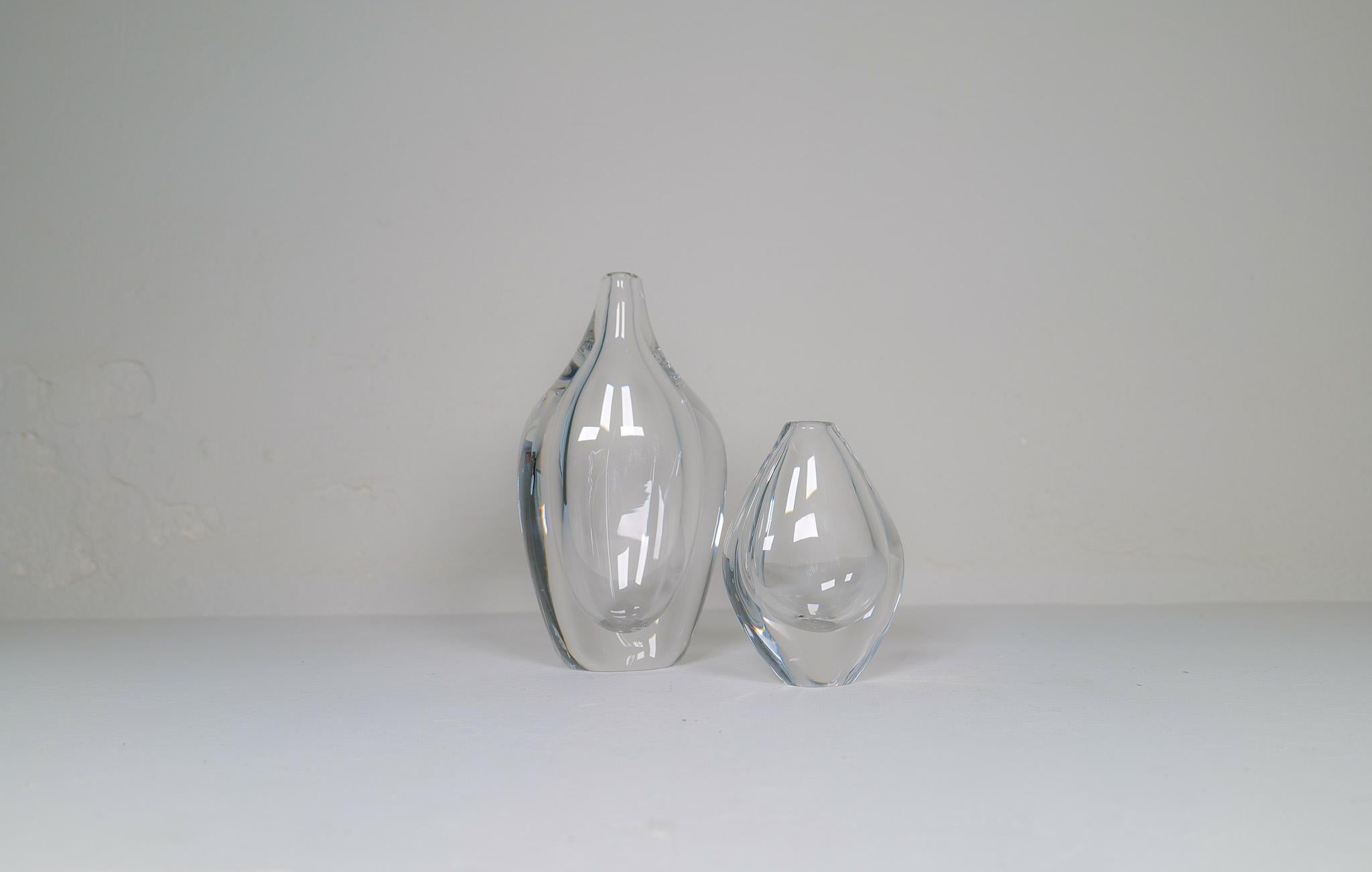 
Wonderful art glass vases designed by Erika Lagerbielke and Nils Landberg produced at Orrefors, Sweden. The large one is extremely heavy and together they give a great modern look. 

Good condition signed and labeled.

Measures: H 29cm, W 16 cm D 9