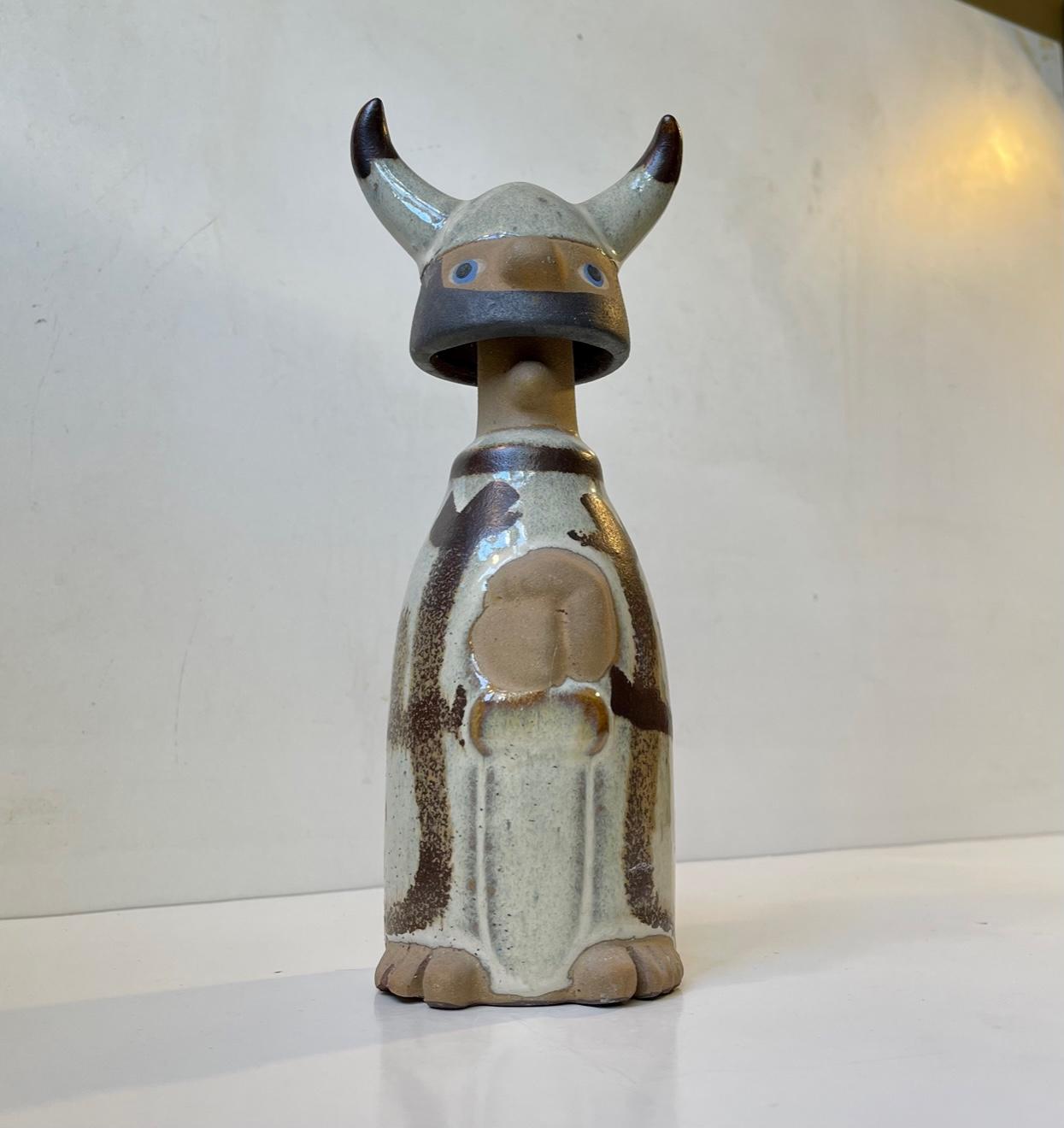 A Lisa Larson inspired viking sculpture/figurine in hand-glazed studio ceramic. Unknown Scandinavian designer/maker circa 1970. It has no markings but suspect it was made by either Knabstrup or Søholm in Denmark. Measurements: H: 23.5 cm, W: 9 cm,