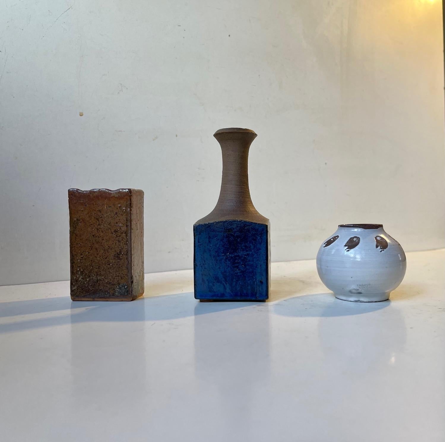 Mixed lot of 3 small Scandinavian ceramic vases. All studio made by diffrent Scandinavian designers/ceramist. Styles: Nordic abstract, midcentury. Measurements: Vase 1: 11/5/5 cm, Vase 2: 5.5/5 cm, Vase 3: 8/4.5/3 cm. The price is for the set of 3.