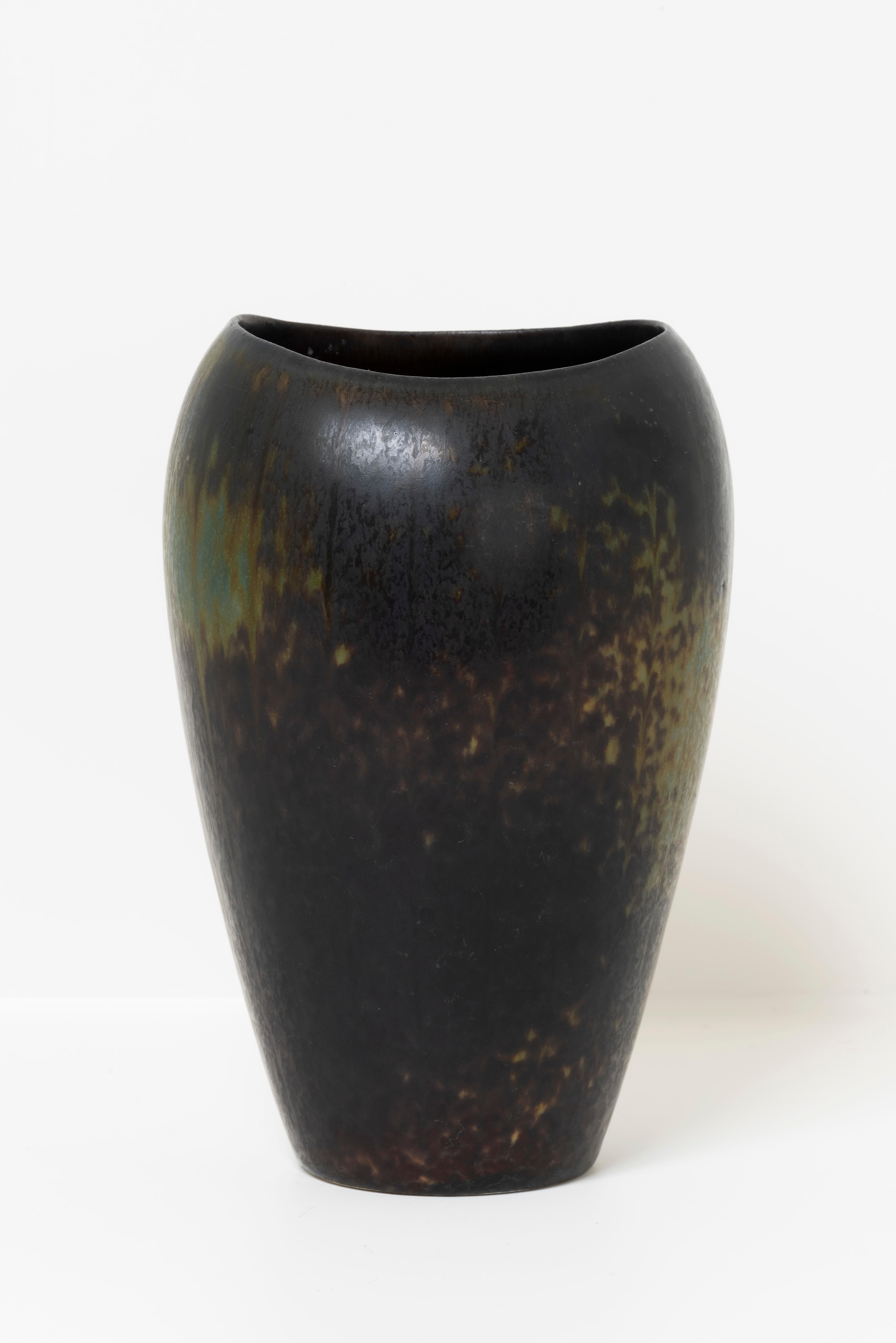 Gunnar Nylund was a Swedish ceramist whose artistic mark on the world of ceramics is undeniable. During the 1960s, Nylund created pieces that reflected his creative ingenuity and commitment to high-quality craftsmanship. 

Gunnar Nylund's stoneware