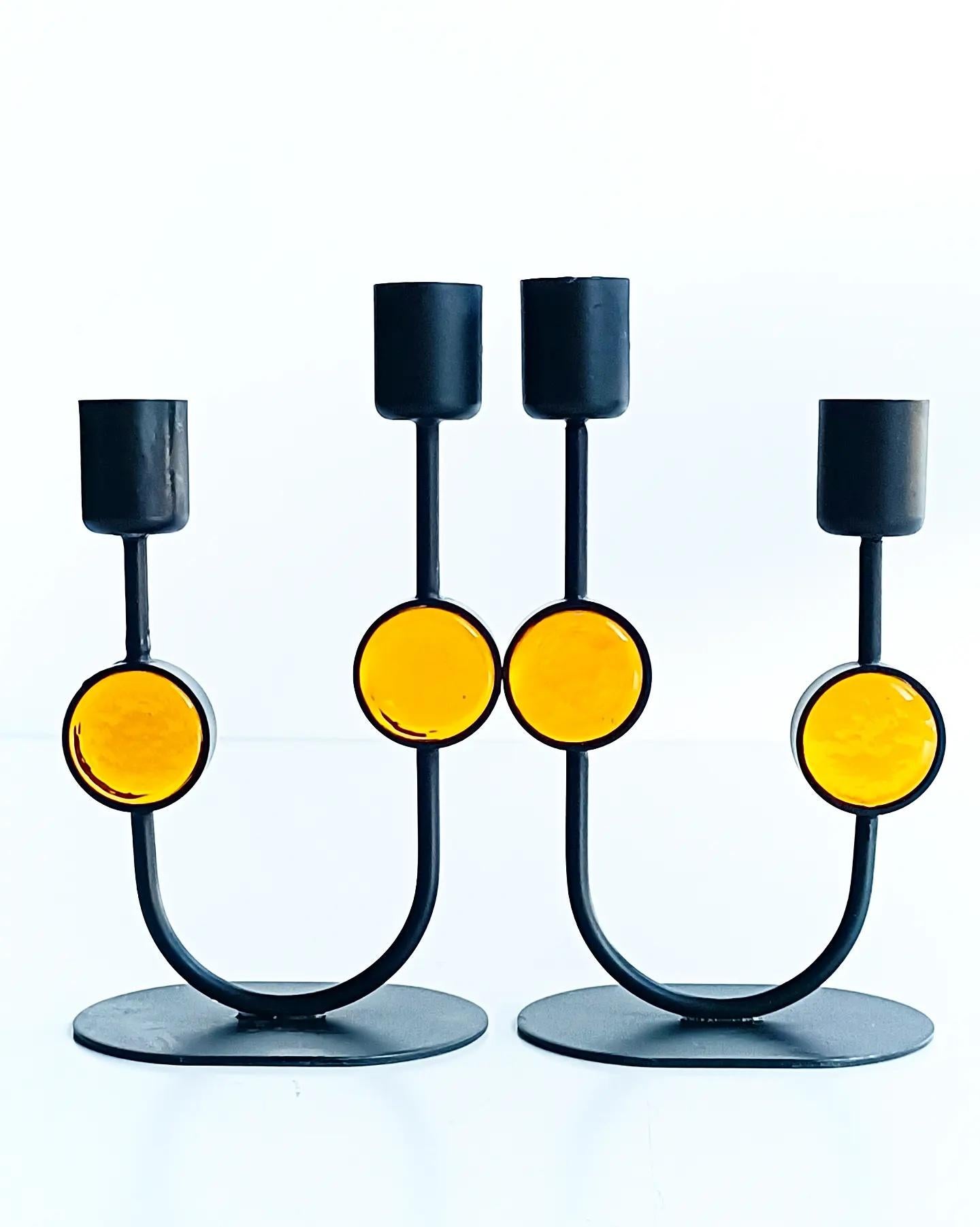 Beyond cool pair of candle holders designed by Gunnar Ander for Ystad-Metal. Handcrafted in Sweden during the 1950s, these candle holders are a testament to Ander's unparalleled creativity and craftsmanship.

Made from durable metal and vibrant