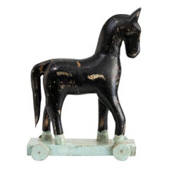 Scandinavian Modern Hand Carved Wooden Toy Horse with with Wheels