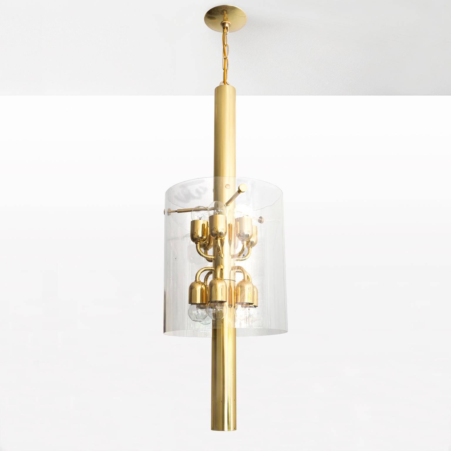 Scandinavian Modern chandelier by Hans-Agne Jakobsson designed for AB in Markaryd, polished brass pendant with 12 arms on a tubular form. A clear 14
