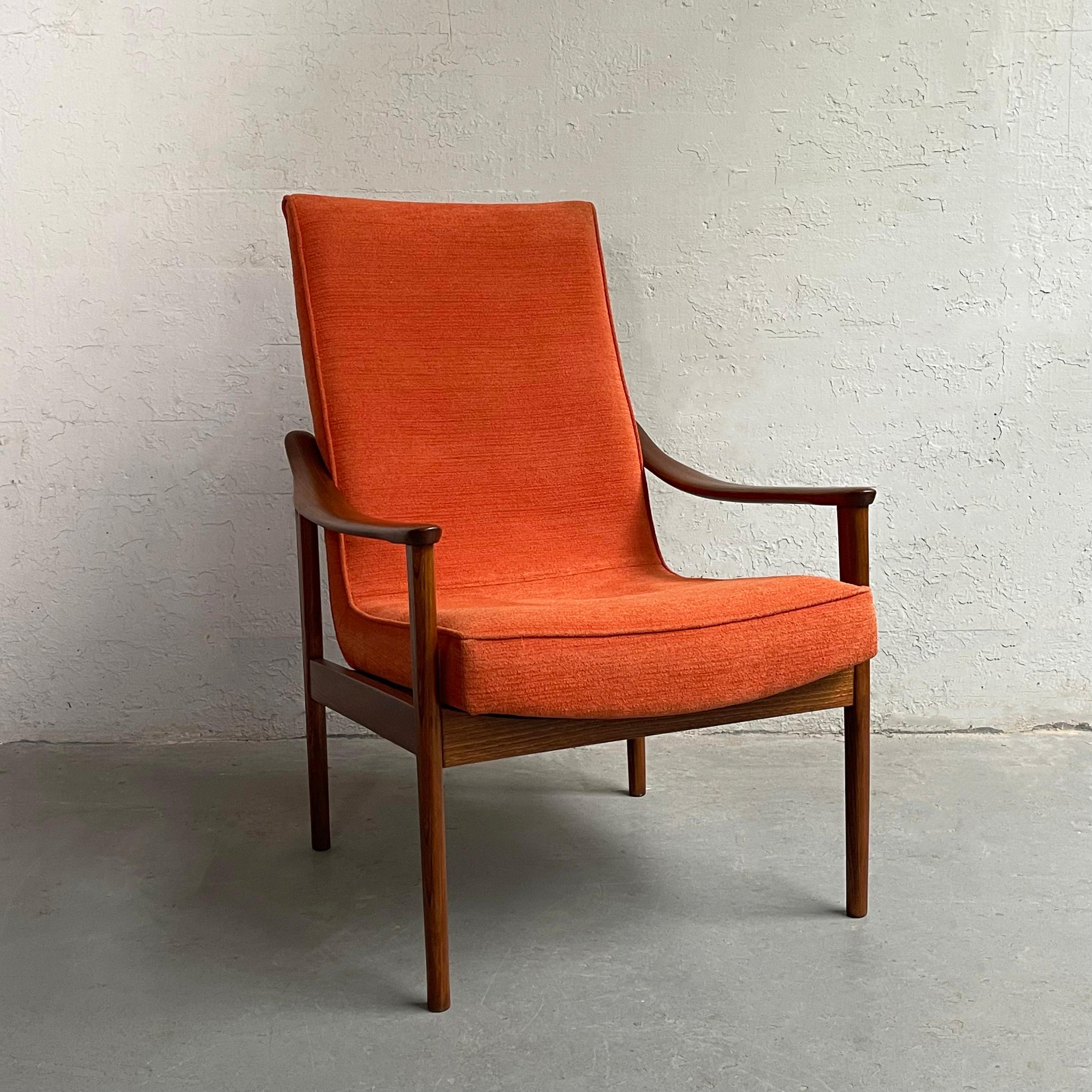 Scandinavian modern, lounge chair produced in Yugoslavia features a minimal beech frame with high back scoop seat newly upholstered in rust chenille.

 