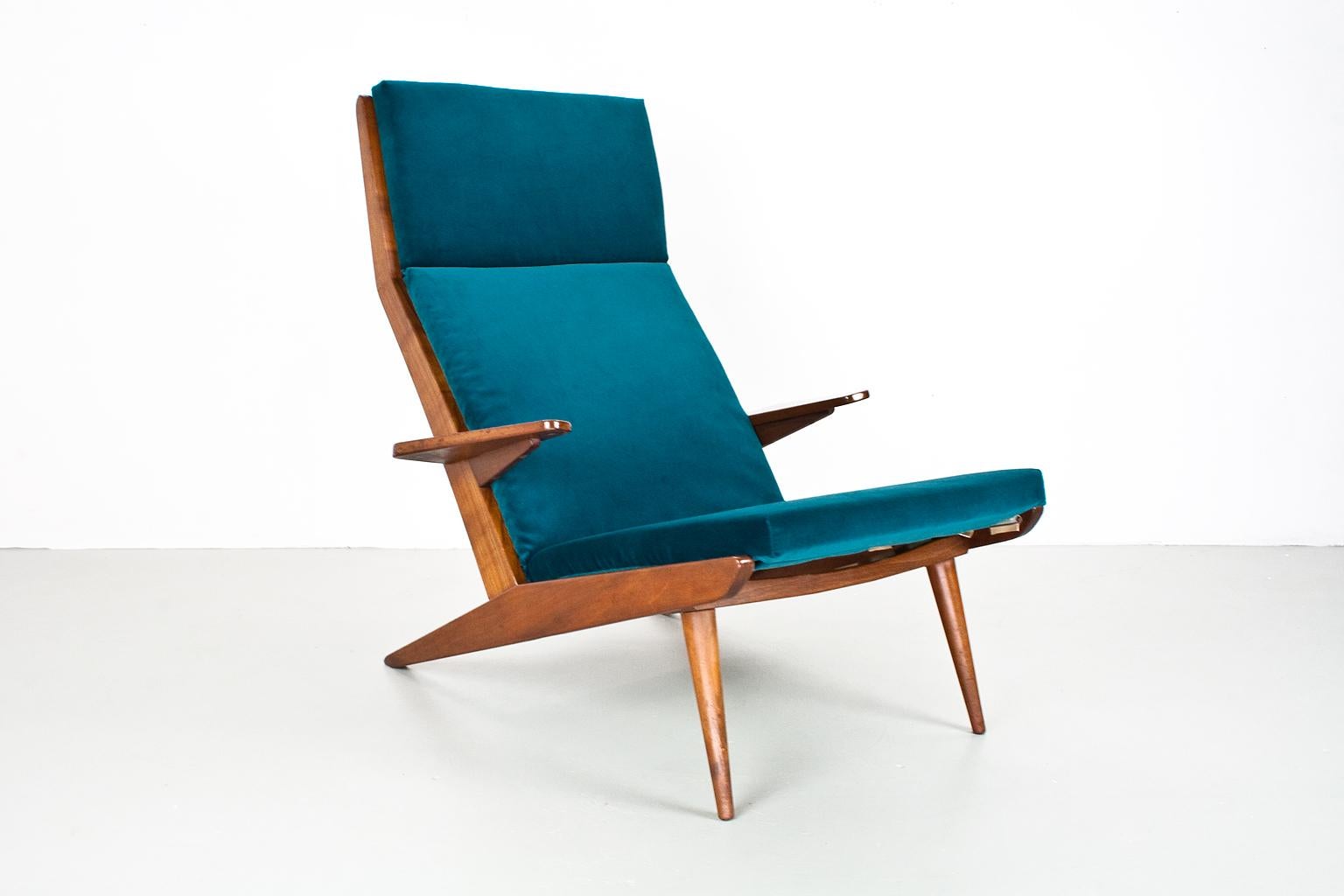 Elegant 1960s lounge chair in teak and re-upholstered in a great quality teal cotton velvet. Large flared armrests and strong, declining back legs.  Timeless mid century modern design which still looks contemporary in any home.

The transparant and
