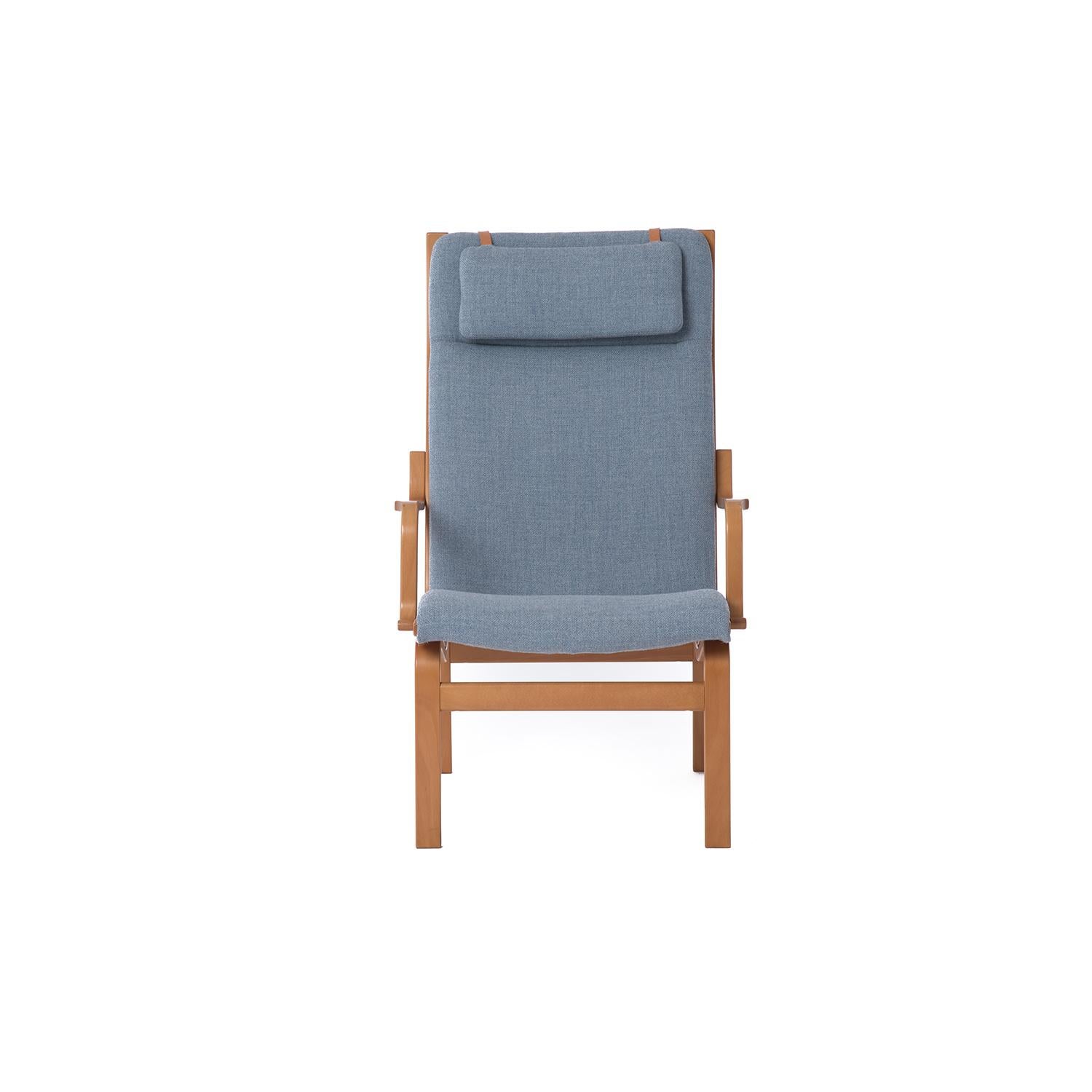 This Scandinavian Modern lounge chair is ergonomically designed for comfort and is lightweight and easy to move and transport. Honey colored beech frame and new upholstery by Knoll Textiles. Head pillow has leather tab connection detail. Design by