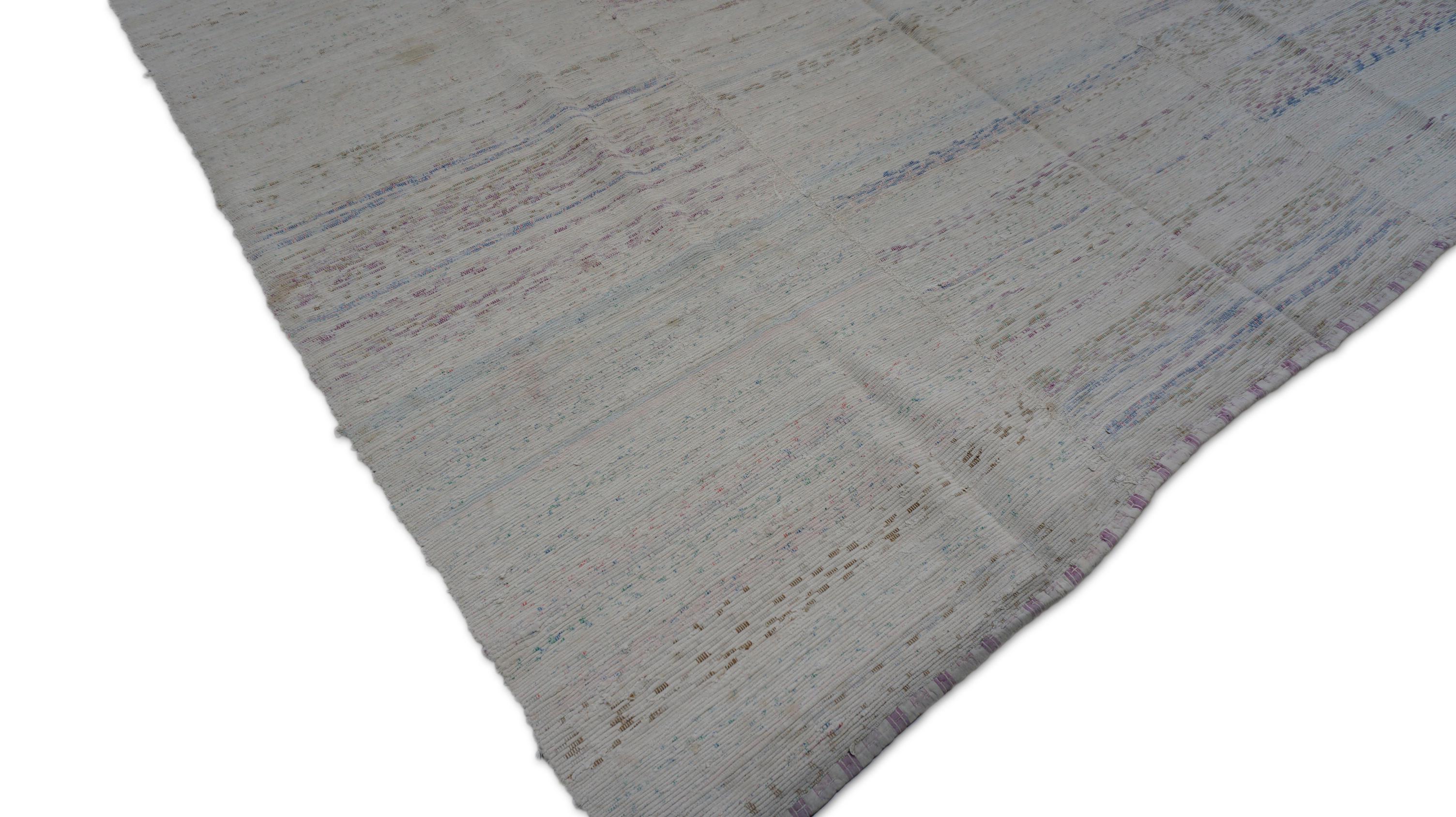 This vintage flatweave kilim is a poetic expression of softness and minimalism, woven by hand using wool. Rug features delicate horizontal striping in a whispery palette of pastel ivory, and gray—offering a dreamy, cloud-like presence.

Crafted with