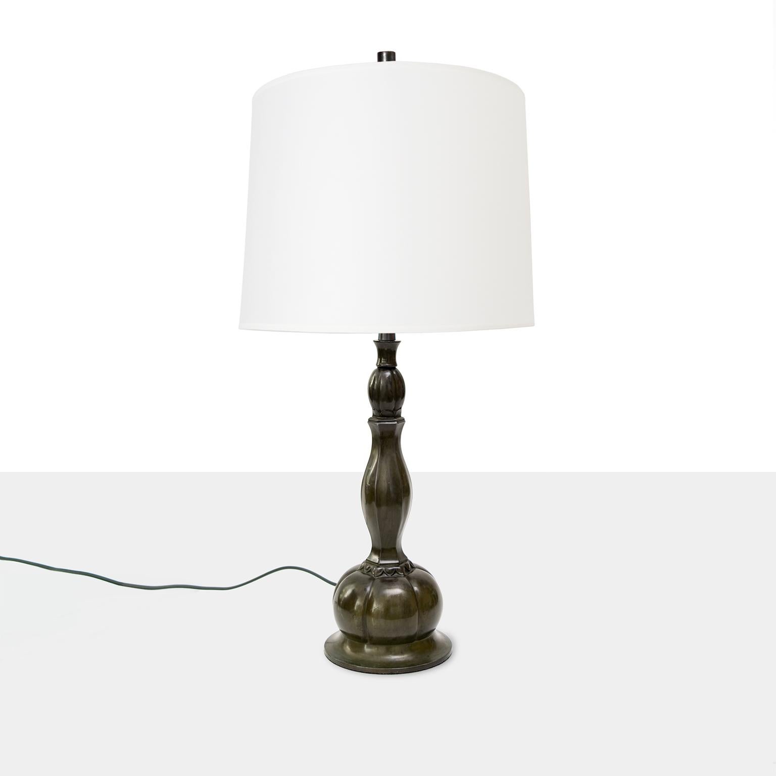 Scandinavian Modern table lamp designed by Just Andersen. This lamp is made from a unique metal alloy developed by Andersen which he named after the Disko Bay in Iceland. Lamp has rewired with a new three-way socket and silk cord, ready for use in