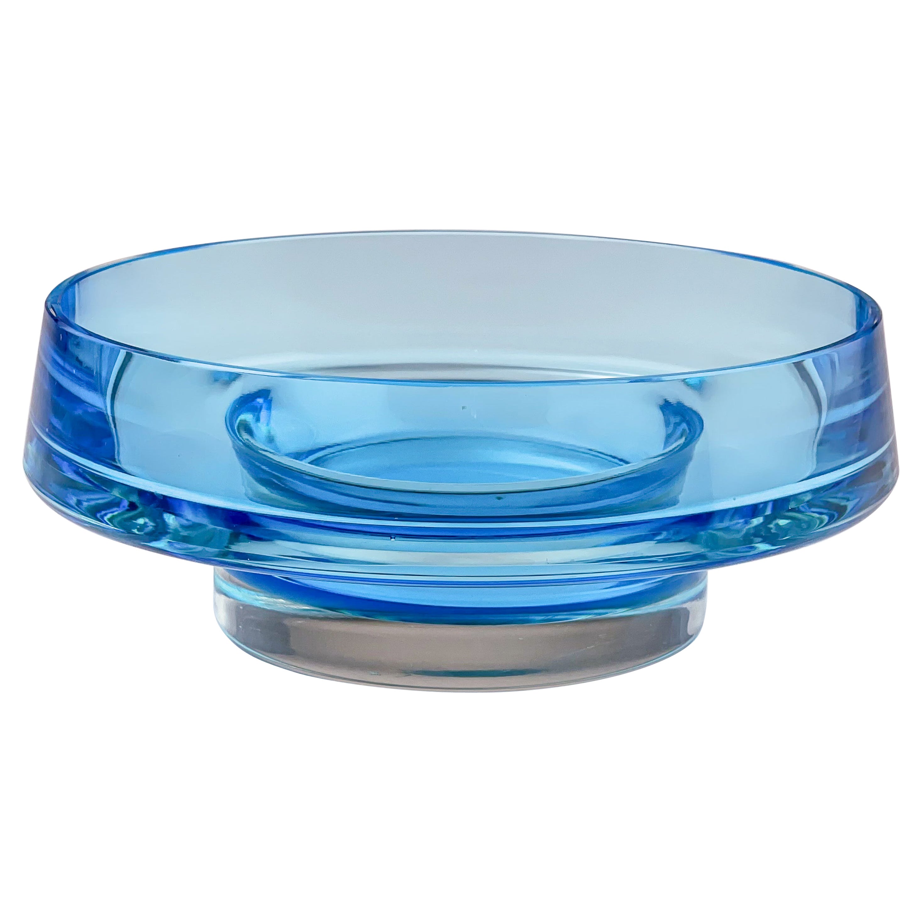 Scandinavian Modern Kaj Franck Glass Art Bowl Handblown Lightblue clear 1960s

Description
A large round, topaz-blue and clear cased glass, moldblown, turned and cut art-object, model KF 261, designed by Kaj Franck in 1960, executed by the