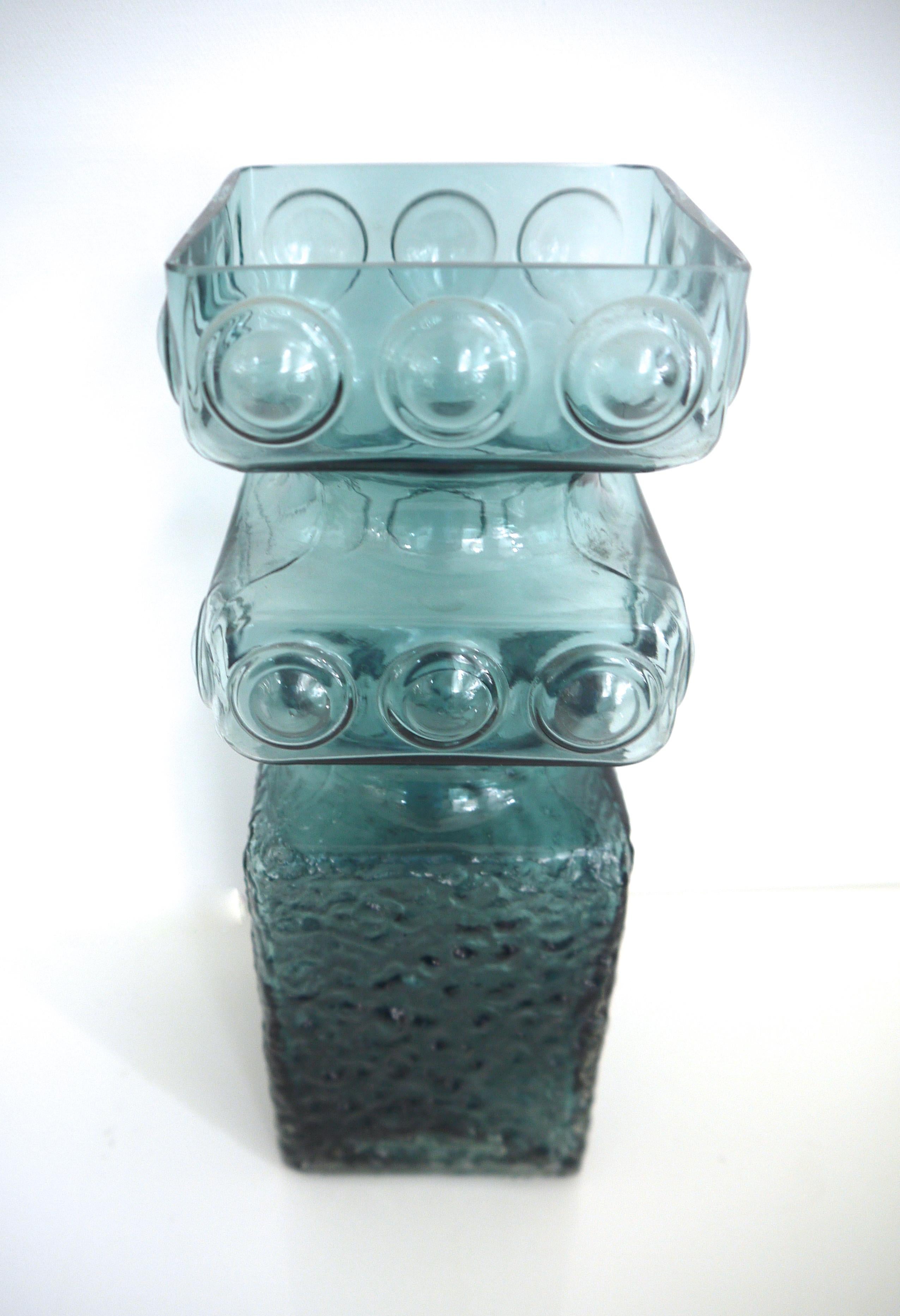 Scandinavian Modern Kehra glass vase by Tamara Aladin Riihimaki (Finland 1950s).

The Riihimaki factory started manufacturing windows and glass bottles from 1910.

Riihimaki was renamed Riihimaen Lasi Oy in 1937, and Aimo Okkolin began designing