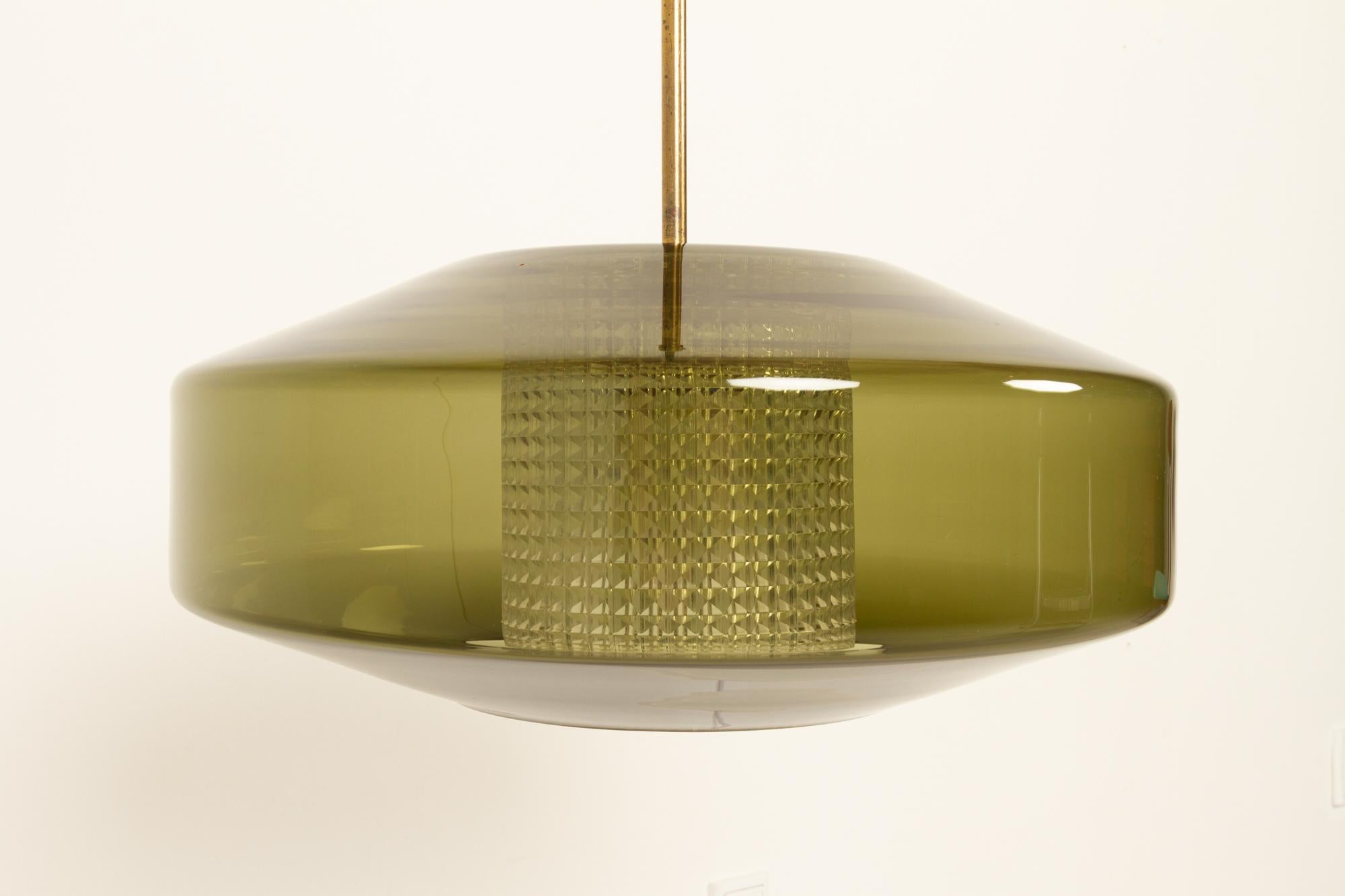 Scandinavian Modern large green glass pendant by Carl Fagerlund for Orrefors 1960s
Beautiful and rare large ceiling lamp from the 60s. Designed by Carl Fagerlund for Orrefors Sweden. Outer shade in hand blown moss green transparent glass and inner