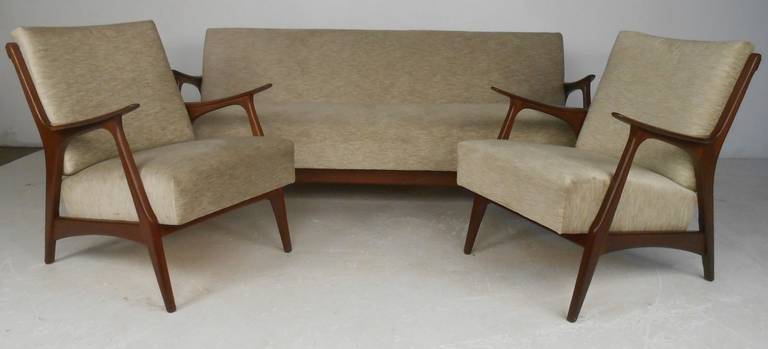 Stylish three-piece Danish modern living room suite with sofa or daybed and two armchairs. Nicely crafted teak frames and sofa easily converts into daybed for added convenience. Please confirm item location (NY or NJ) with dealer.