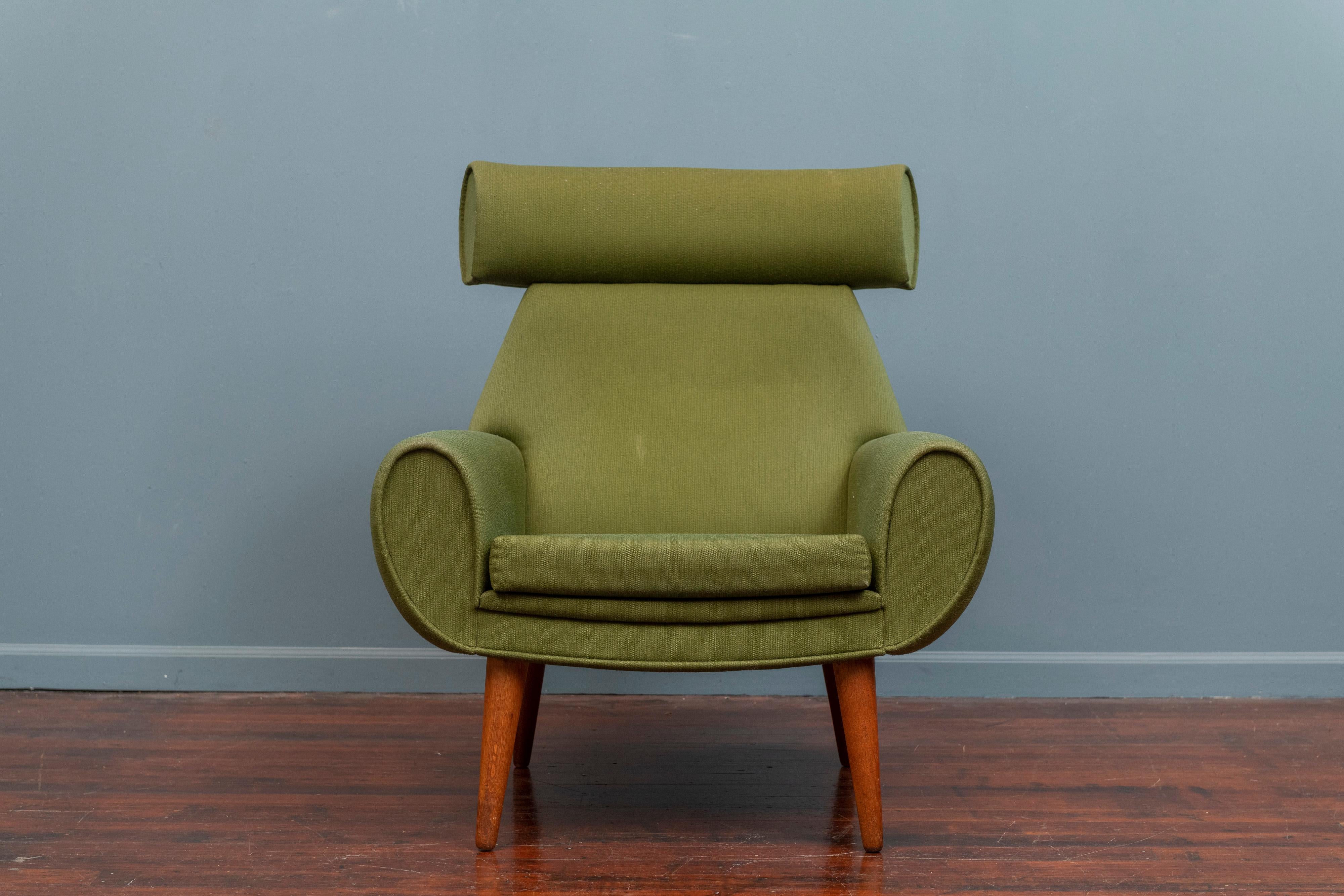 Scandinavian Modern large scale lounge chair, an unusual design by Kurt Ostervig, Denmark. 
The lounge chair is ready to use as-is or reupholster it in C.O.M. on tapering oak legs.