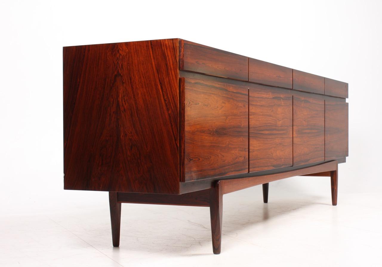 Great looking sideboard in rosewood designed by Maa. Ib Kofod-Larsen. Made by Faarup Møbelfabrik. Model no.66. Original condition.