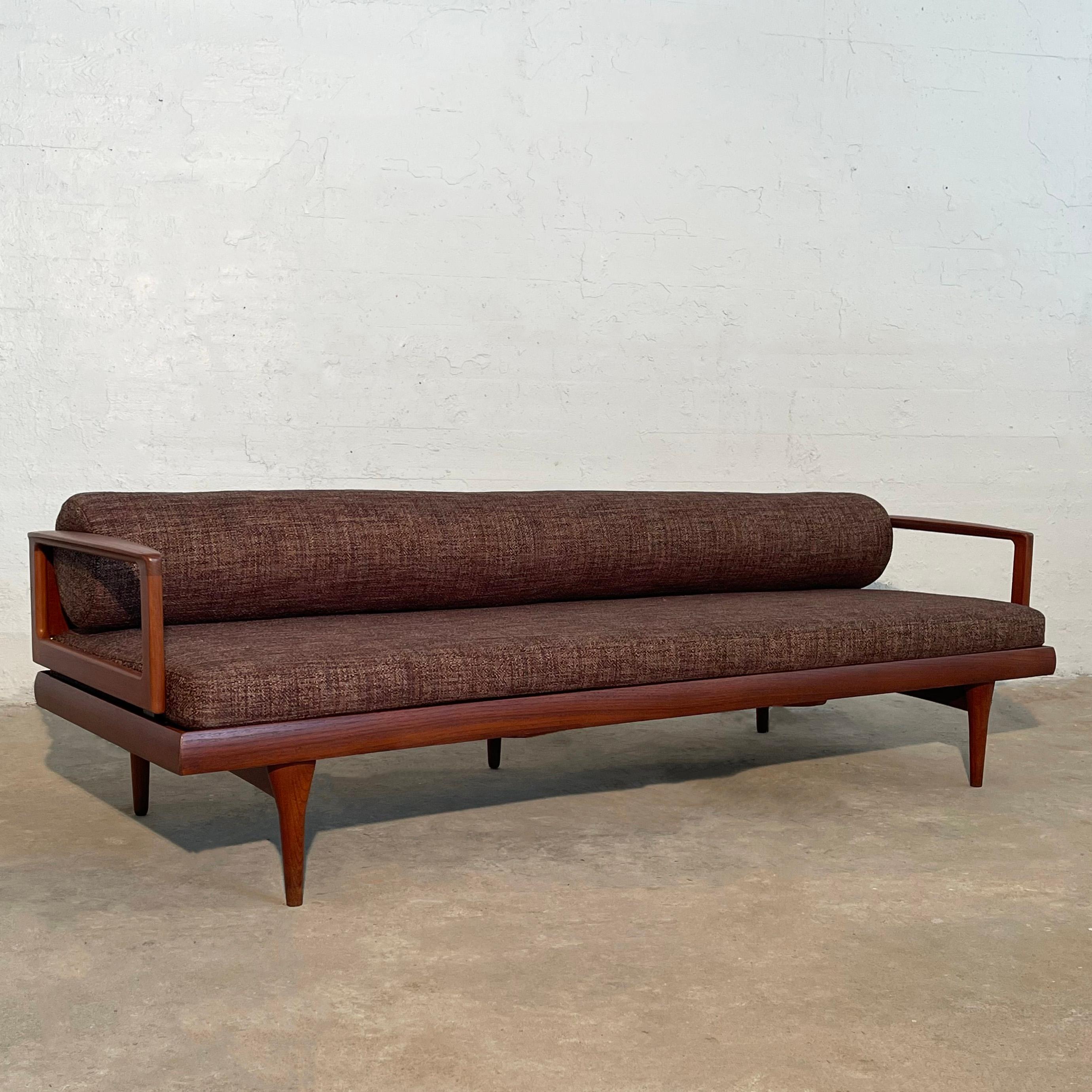 Sleek, low, Scandinavian modern, teak frame sofa features streamlined, chocolate brown tweed upholstery with rolled back cushion. The frame is minimal from the front and sides but features a fantastic geometric slat back. Gorgeous from every angle. 
