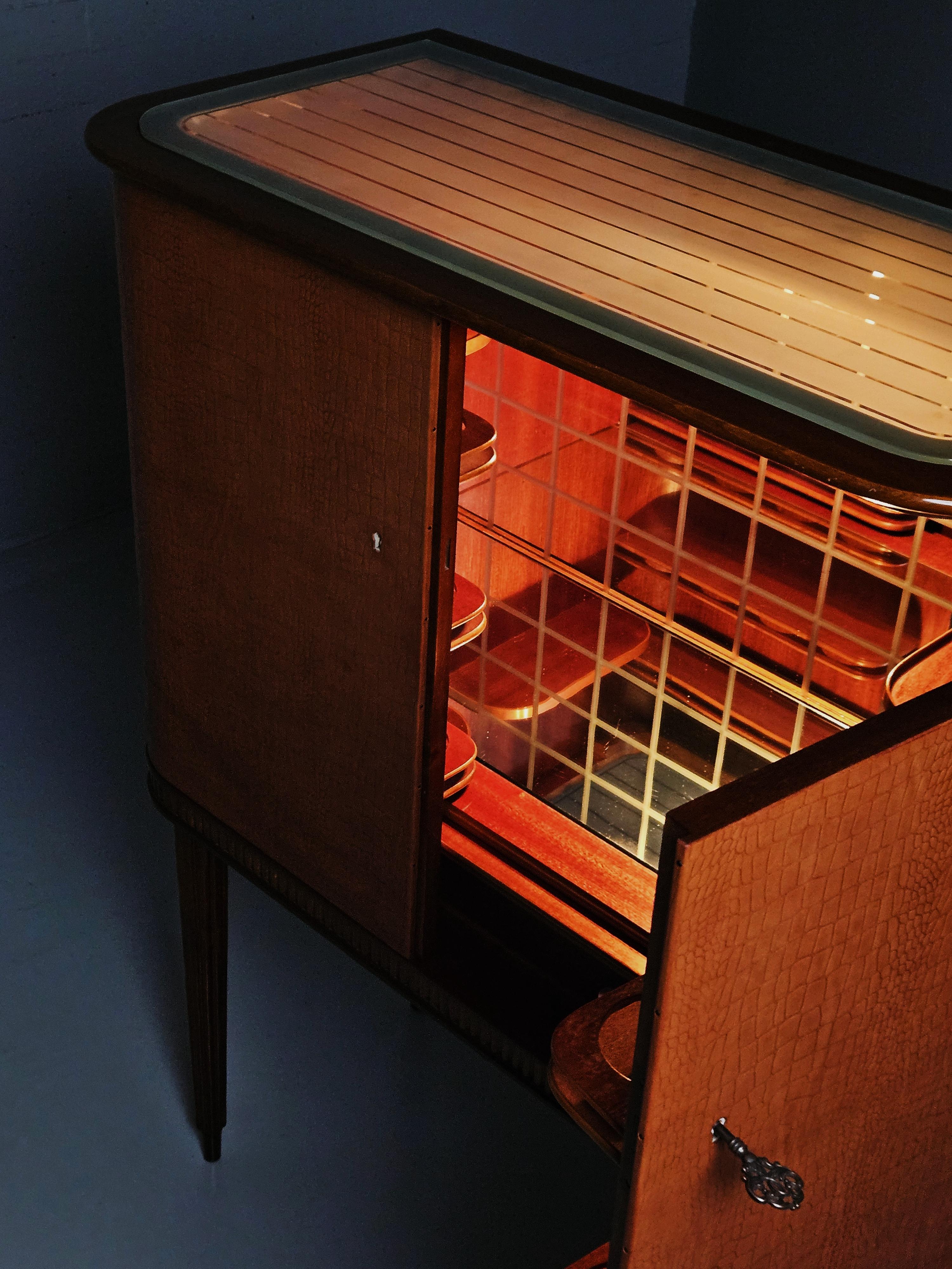 Leather Scandinavian modern mahogany and leather bar cabinet, Sweden, 1950s