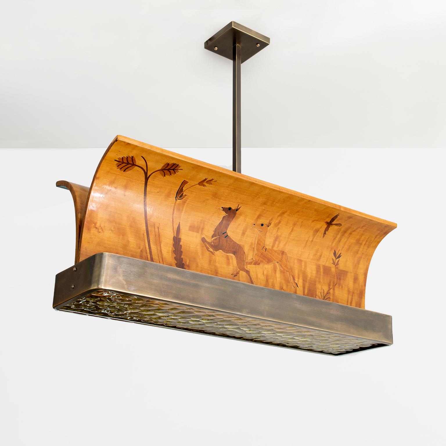Scandinavian Modern marquetry wood and patinated brass pendant produced by Reiners Möbler, Mjölby, Sweden. The fixture has been completely restored and re-wired with four candelabra base sockets which are set above the original textured glass
