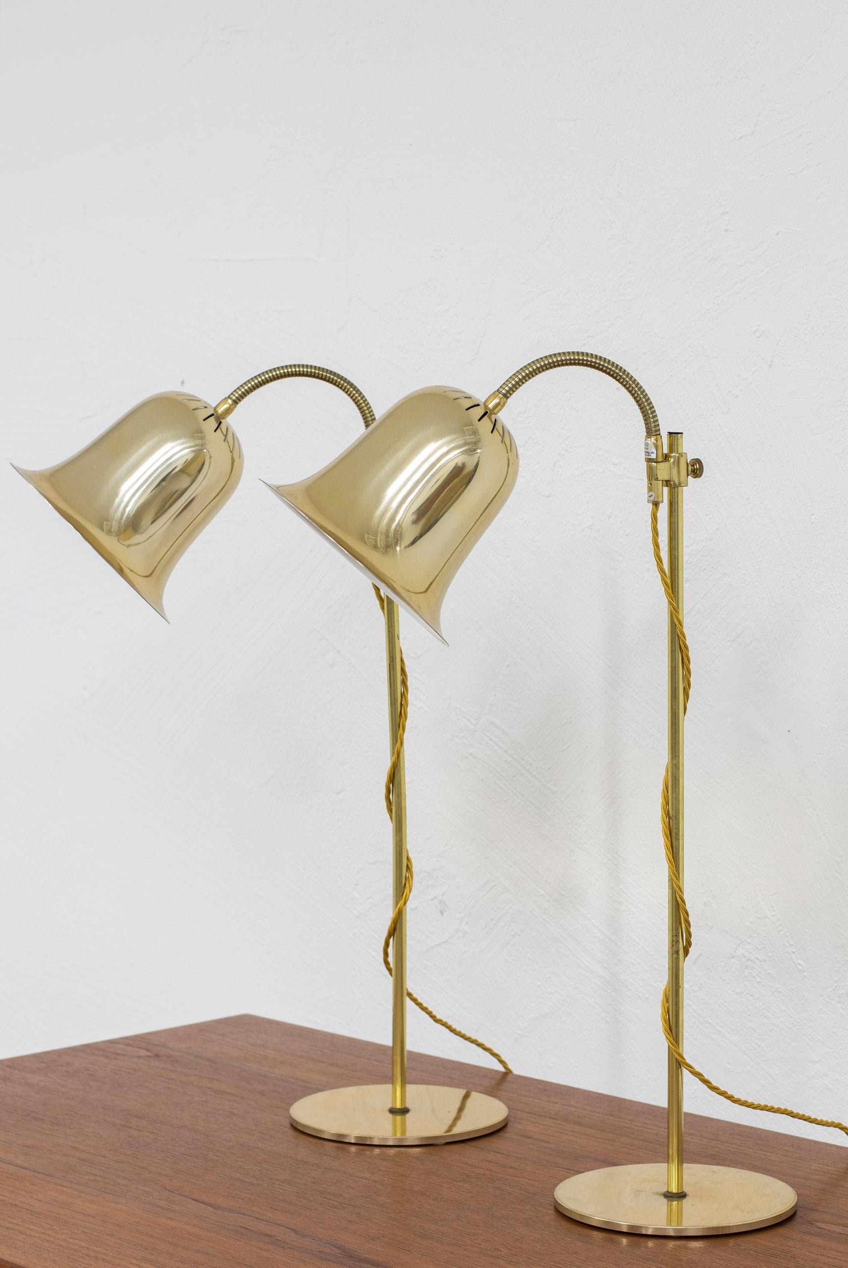 Pair of table lamps produced in Sweden by Trivselbelysning AB. Made from Brass and aluminum. Adjustable in angle and in height. Light switch on the chords. Good vintage condition with some slight age related wear and patina.

Price for the