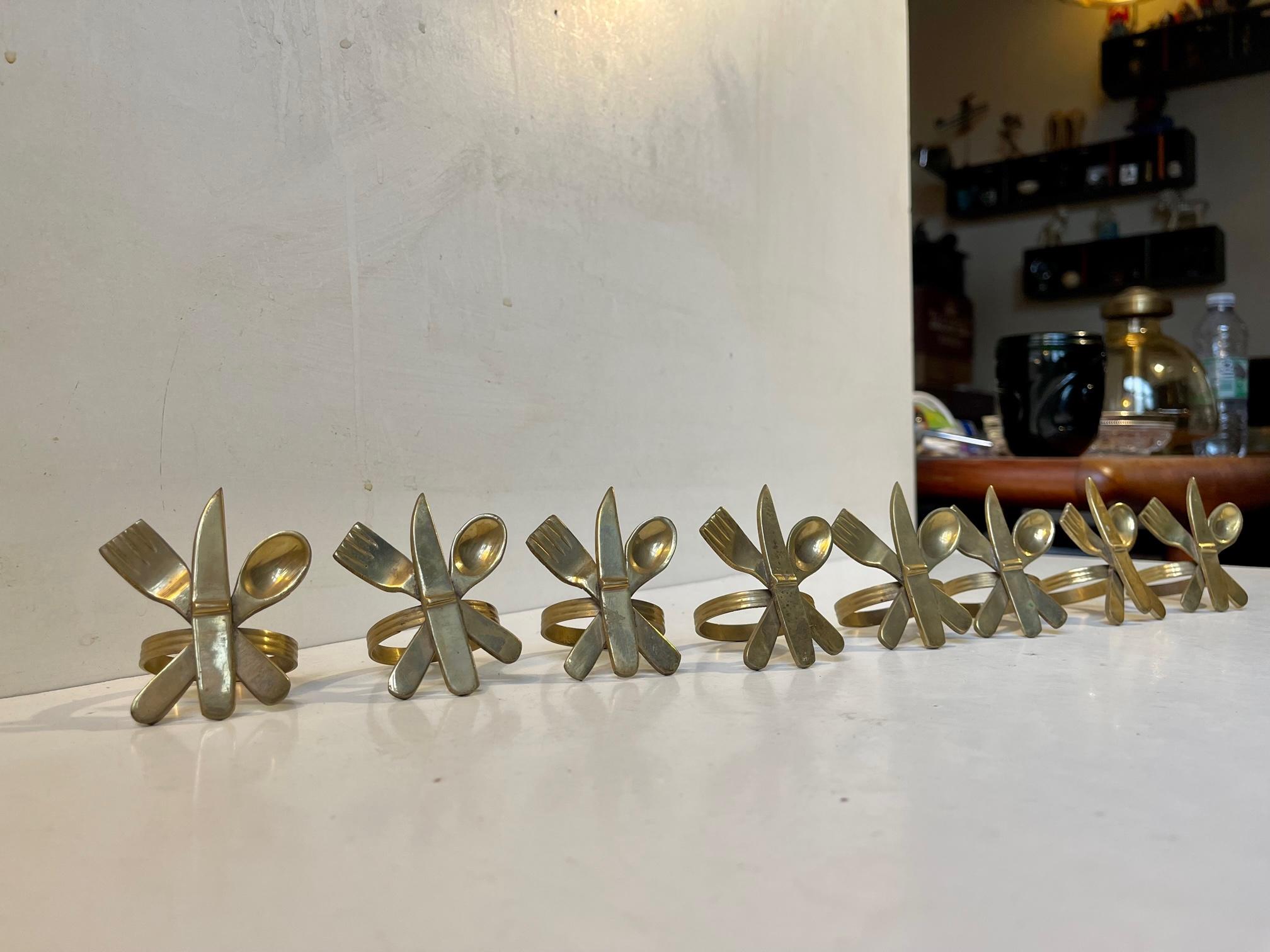 A well-made set of napkin rings cast in brass and featuring motifs of a knife, a fork and a spoon. Made in Scandinavia during the 1960s and originally sold through Illums Bolighus in Copenhagen. Measurements: H/W: 6/5 cm, Ring diameter: 4 cm. This