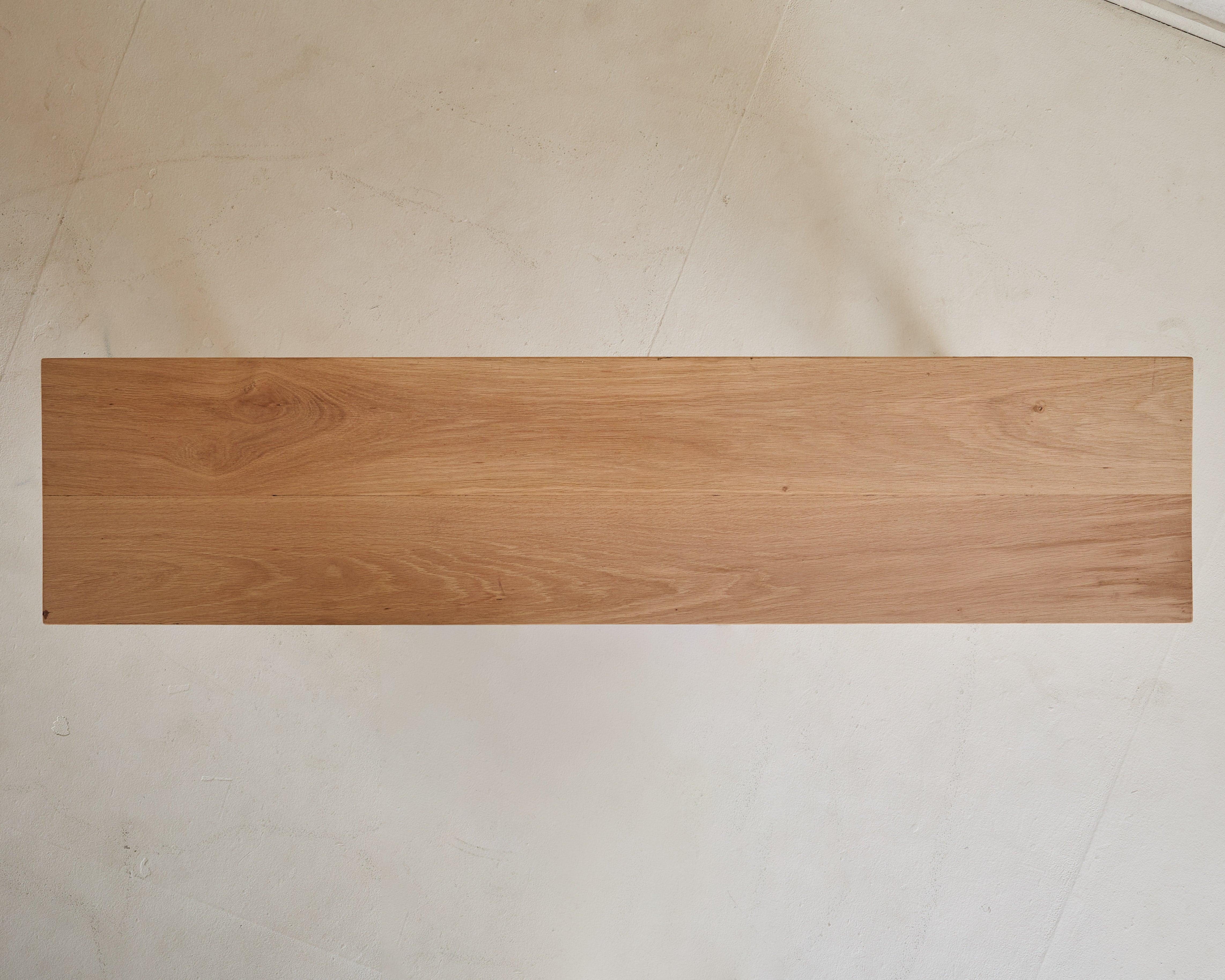 With clean lines and exceptional joinery, this narrow console table captures the essence of mid-20th-century Scandinavian Modern design. Crafted from blonde oak, its warm tone and subtle grain enhance the minimalist aesthetic, while the unique
