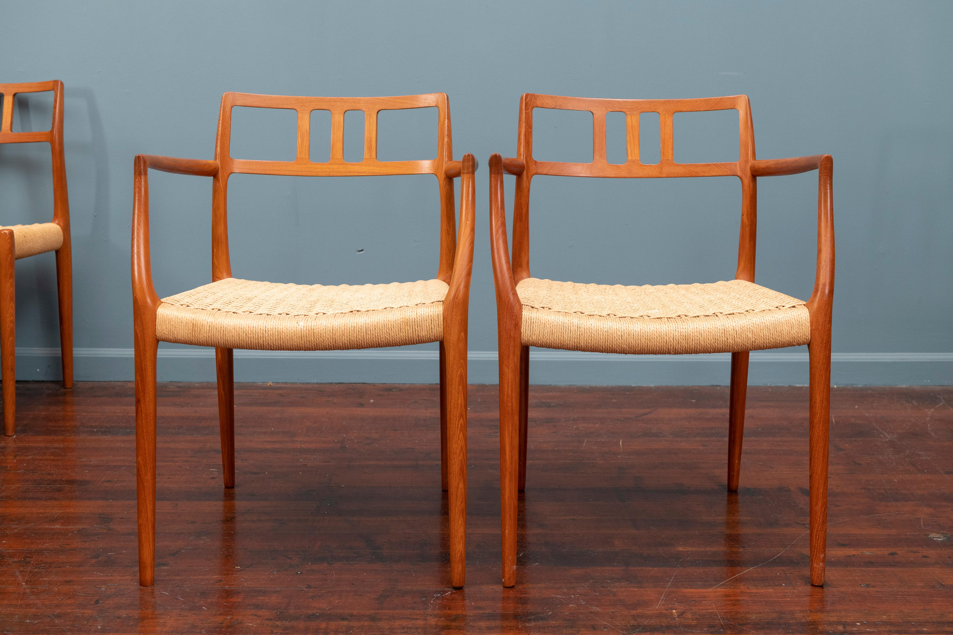 Scandinavian Modern teak dining chairs designed by Niels O. Moller for J.L. Moller, Denmark. Comprising 2 armchairs and 6 sides all frames in very good original condition seats have age appropriate wear and use but still present very well.