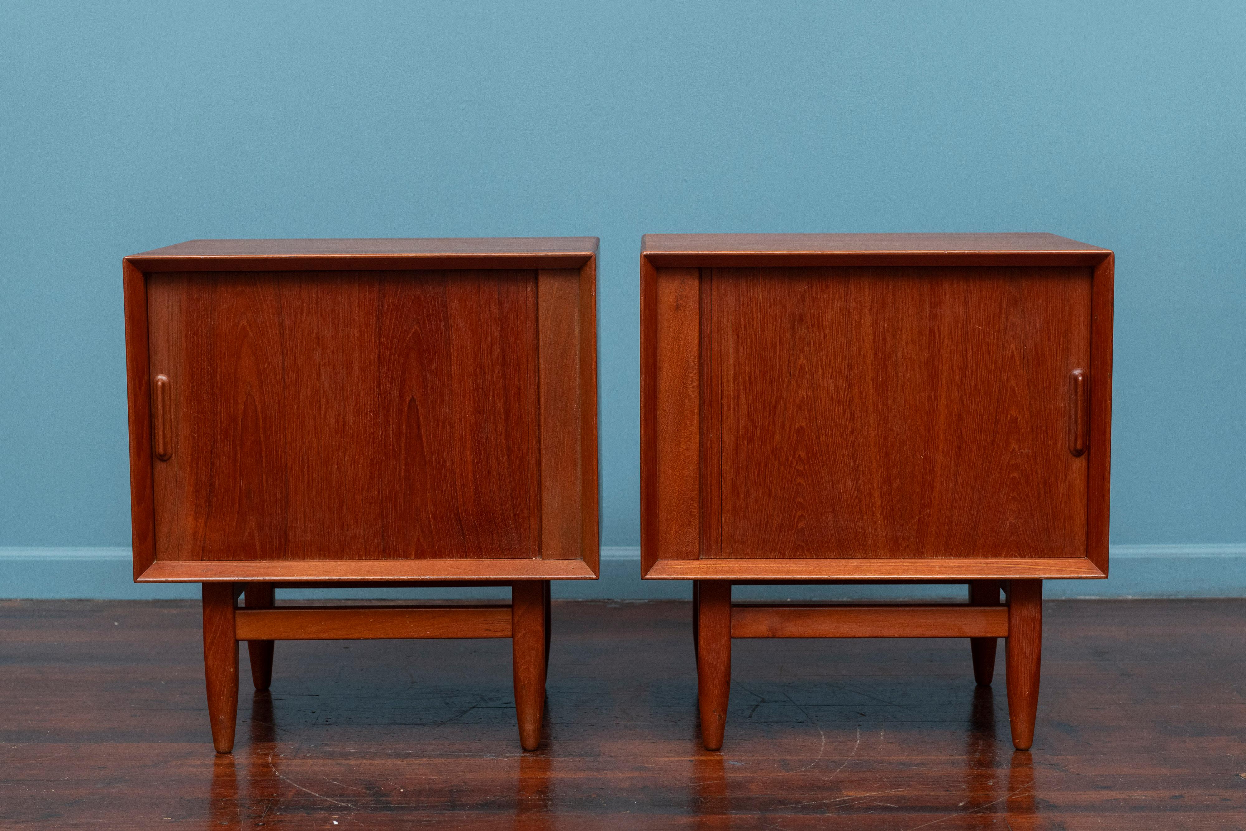 Danish Modern teak nightstands by Falster, Denmark. Featuring tambor doors a left and a right hand directional opening for either side of the bed. High quality construction and material just newly refinished and ready to install. 