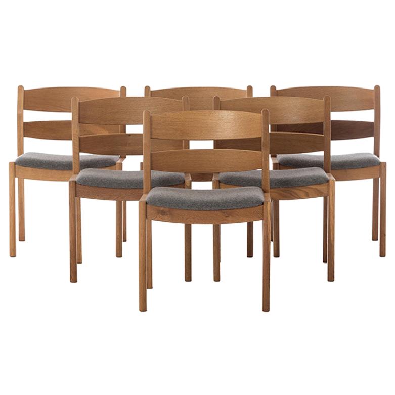 Scandinavian Modern Oak Dining Chairs with Boiled Wool Seats by Kurt Ostervig