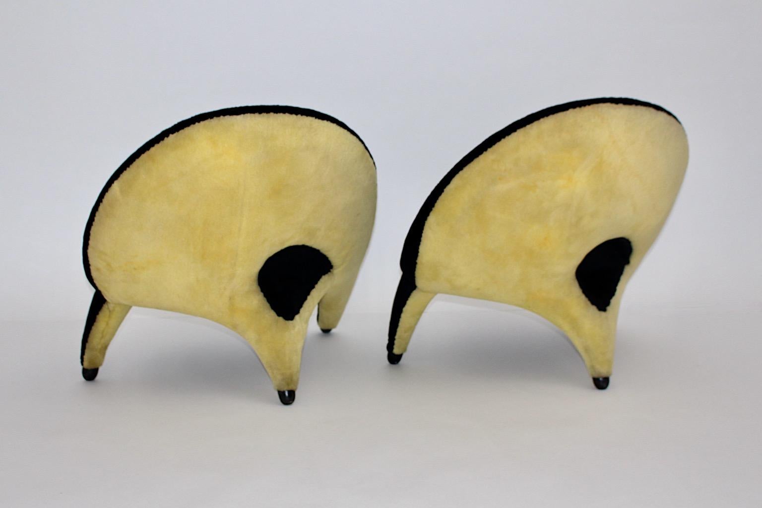 Mid-Century Modern vintage authentic pair of lounge chairs or club chairs by Folke Jansson for SM Wincrantz from black yellow fabric, 1955, Sweden in beautiful organic shape.
A gorgeous pair of lounge chairs or club chairs from fluffy plushy