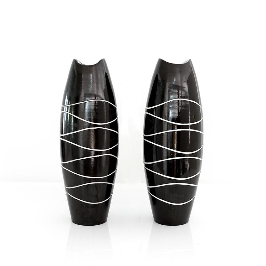 A large pair of Scandinavian Modern pair of “Atoll” Vases designed by Hjördis Oldfors for Upsala Ekeby, Sweden, 1950s.

Measures: H 17.75”, Dia 6”.

 