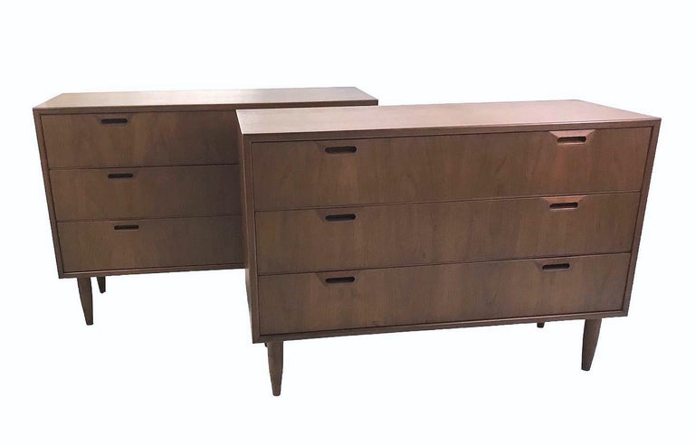 Fine smaller scale and low pair 3-drawer walnut dressers. Beautiful, figured graining and craftmanship from a Danish manufacturer in the 1950s. They are low and not too deep, perfect as bedside cabinets or dressers. Original finish. Minor age and