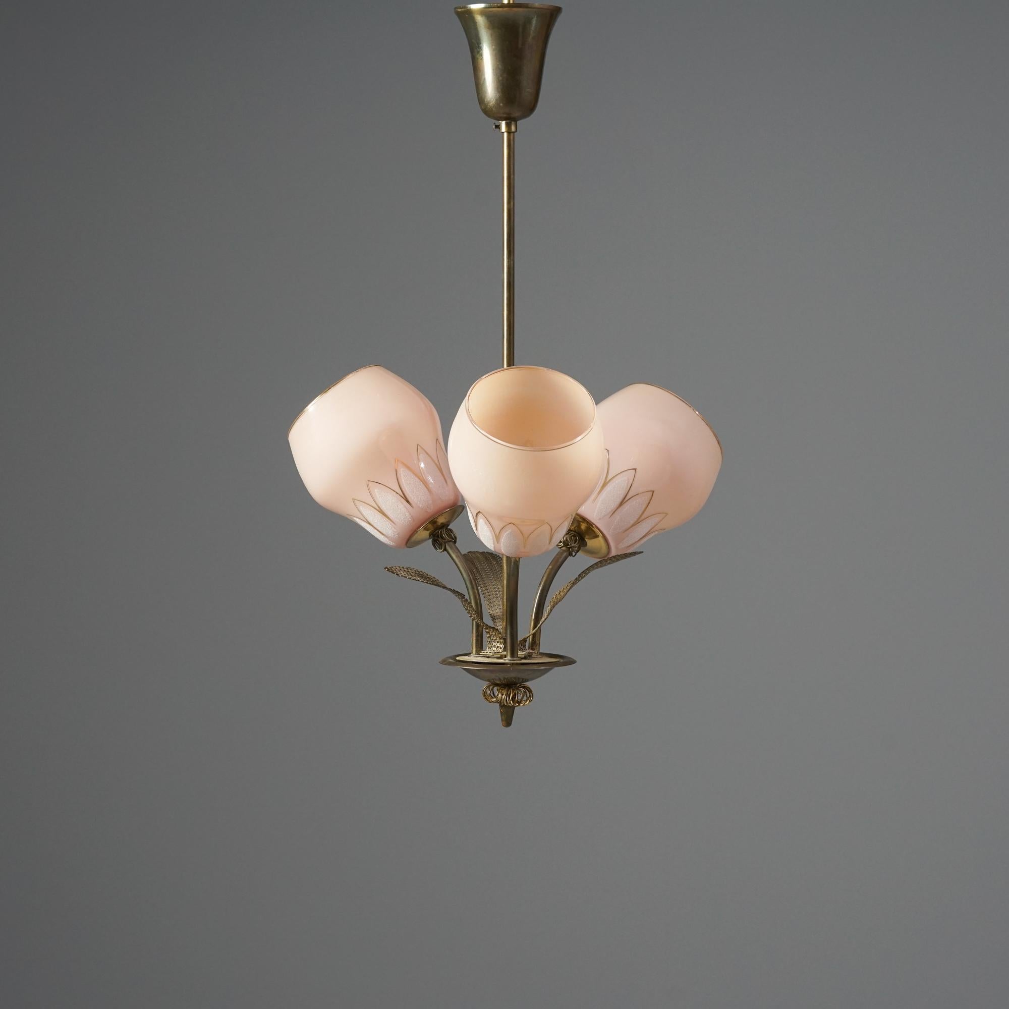 Scandinavian Modern pendant, manufactured by Itsu Oy, Finland, 1950s. Brass frame and details, glass shades. Good vintage condition, patina consistent with age and use. 
