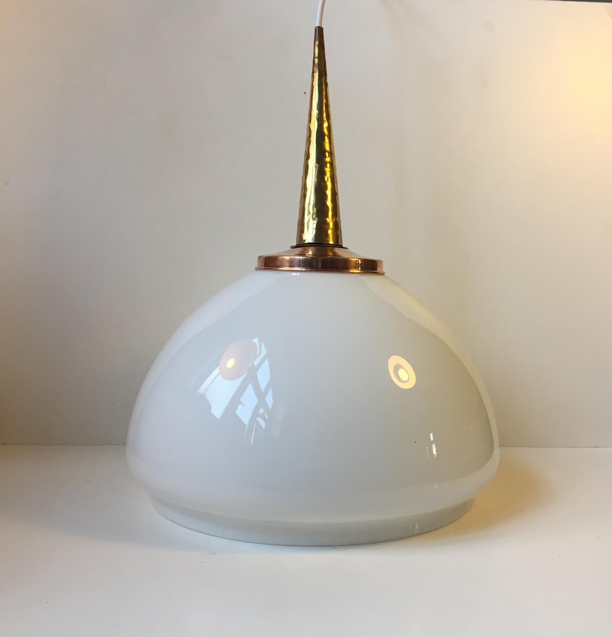 Large mushroom shaped opaline glass ceiling lamp. The top is made from polished copper and hammered brass. Unknown Scandinavian maker/designer in the manner of Lisa Johansson-Pape and Paavo Tynell.