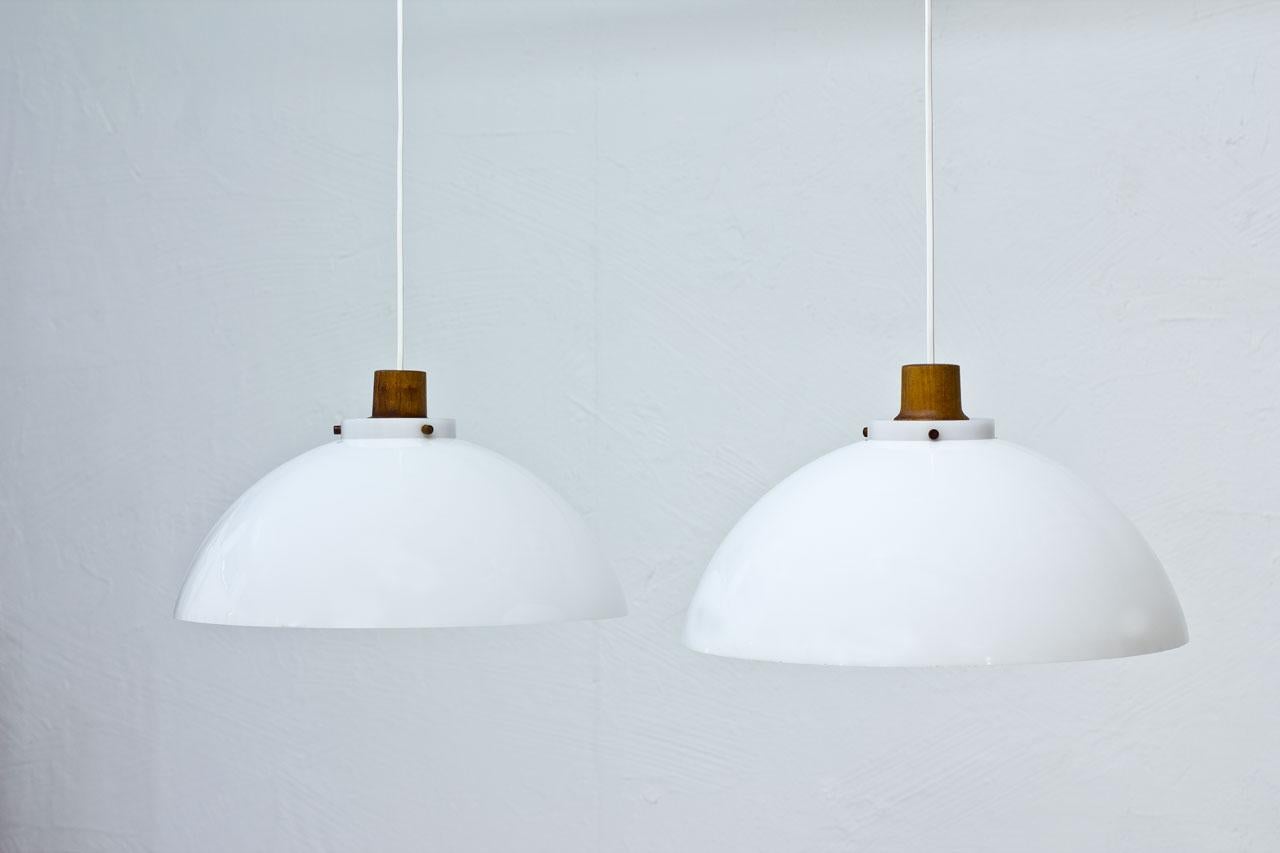 Swedish Scandinavian Modern Pendant Lamps in Teak and Acrylic by Luxus, Sweden, 1950s
