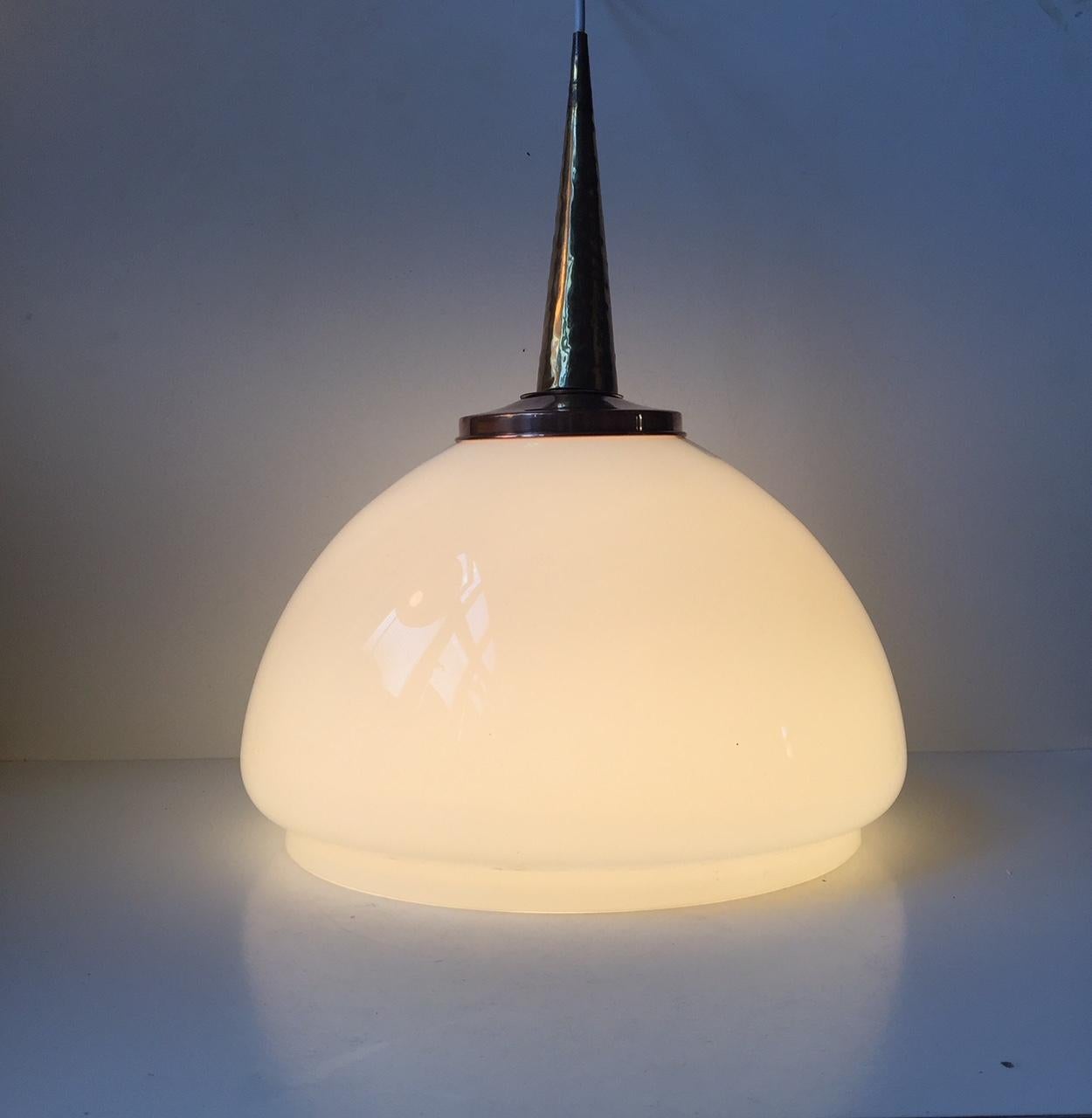 Large mushroom shaped opaline glass ceiling lamp. The top is made from polished copper and hammered brass. Unknown Scandinavian maker/designer in the manner of Lisa Johansson-Pape and Paavo Tynell.