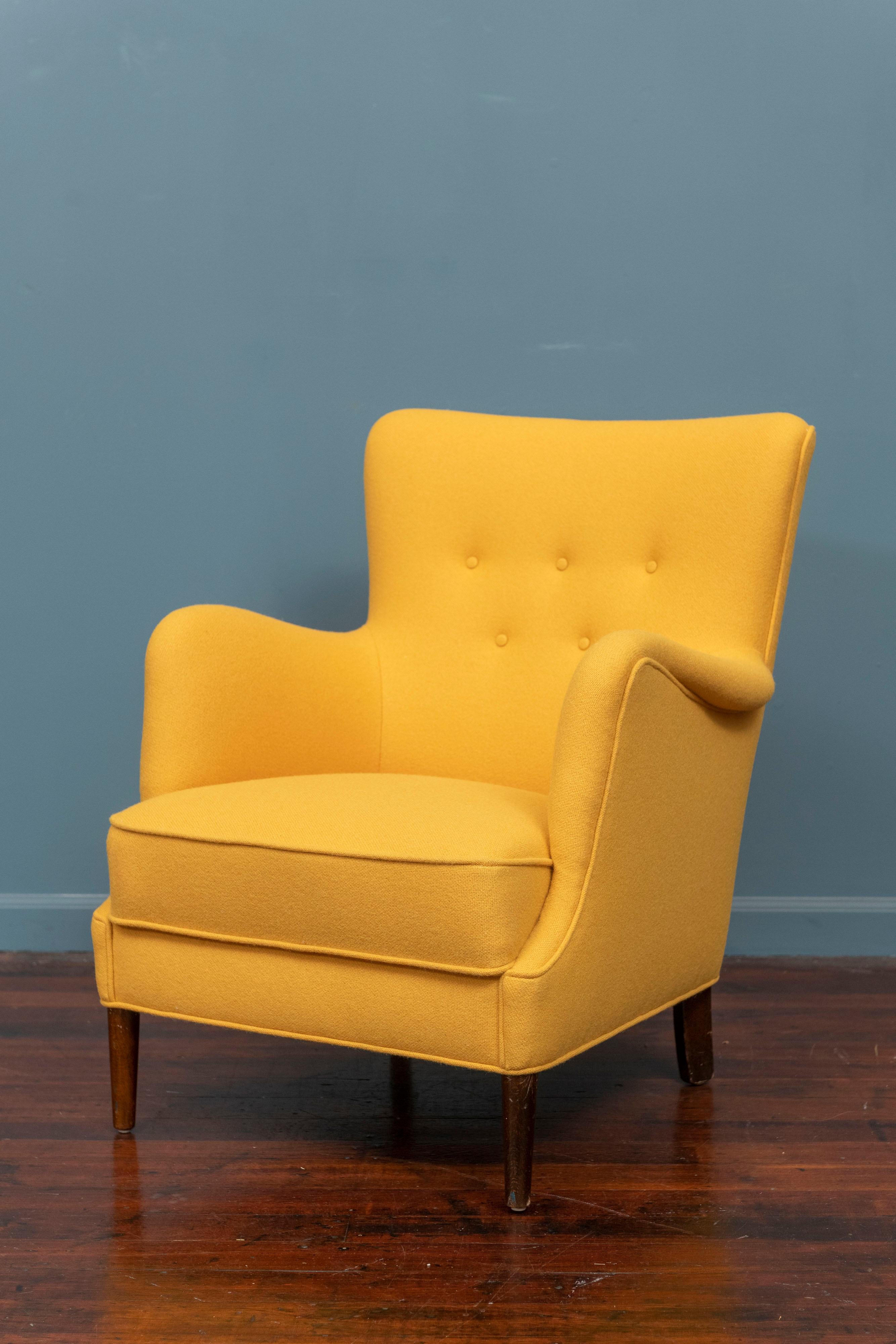 Scandinavian Modern petite lounge chair newly upholstered in a cheerful yellow wool. Super comfy and ready to be enjoyed.