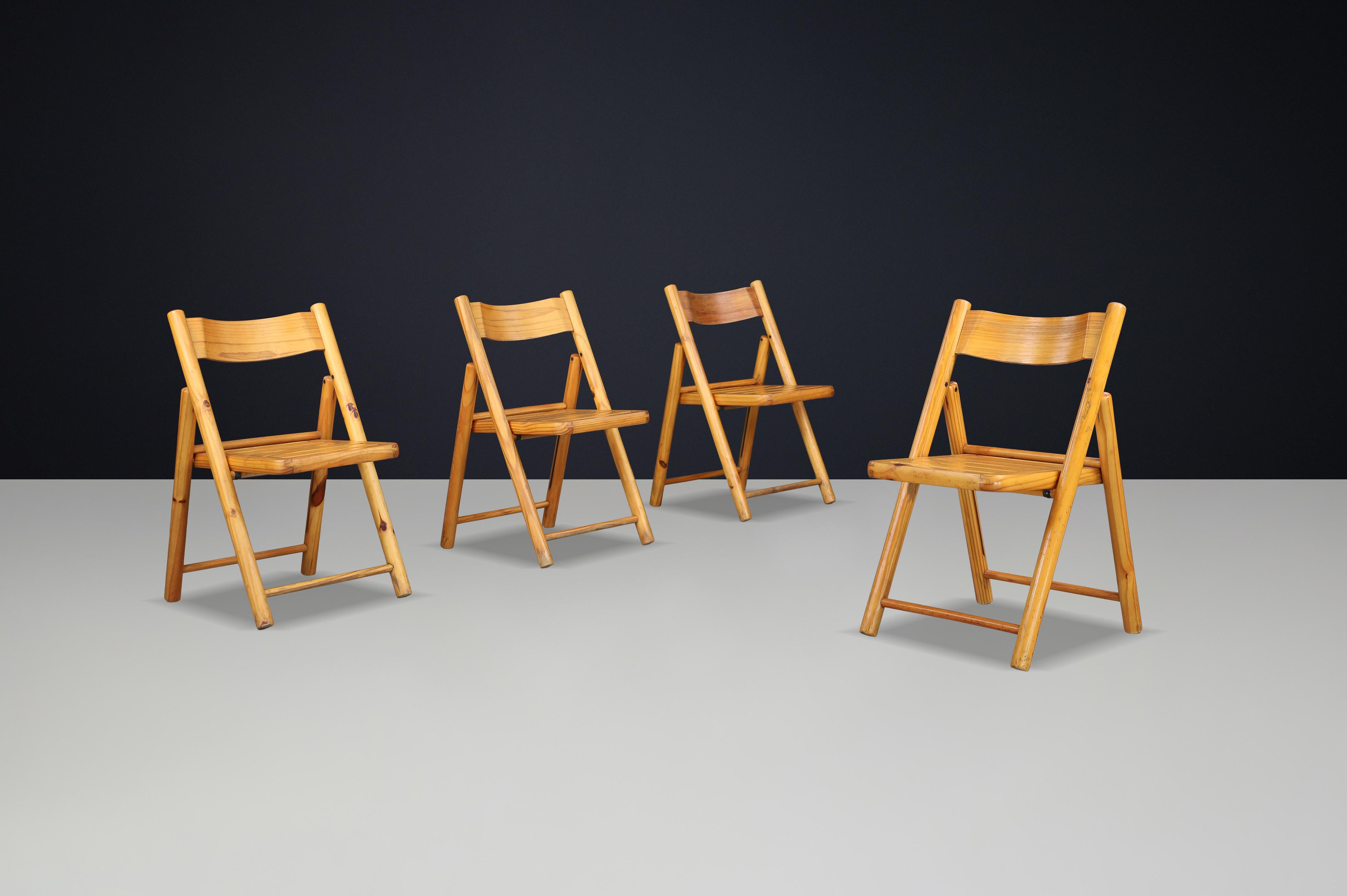 Scandinavian Modern Pine Folding Chairs, in the Style of Rainer Daumiller for Hirtshals Sawmill, Denmark, 1970s

This set of four Scandinavian Modern folding chairs embodies the clean lines, functional design, and natural warmth that defined Danish