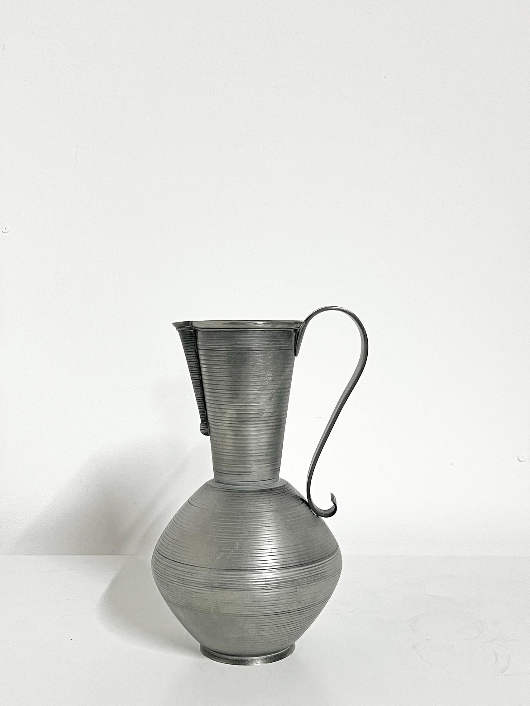 Rare Scandinavian Modern pitcher in pewter by Gunnar Havstad, Norway, ca 1930-40s. 
Signed underneath.
Wear and patina consistent with age and use. 
Scratches, marks and blemishes, smaller dents. 