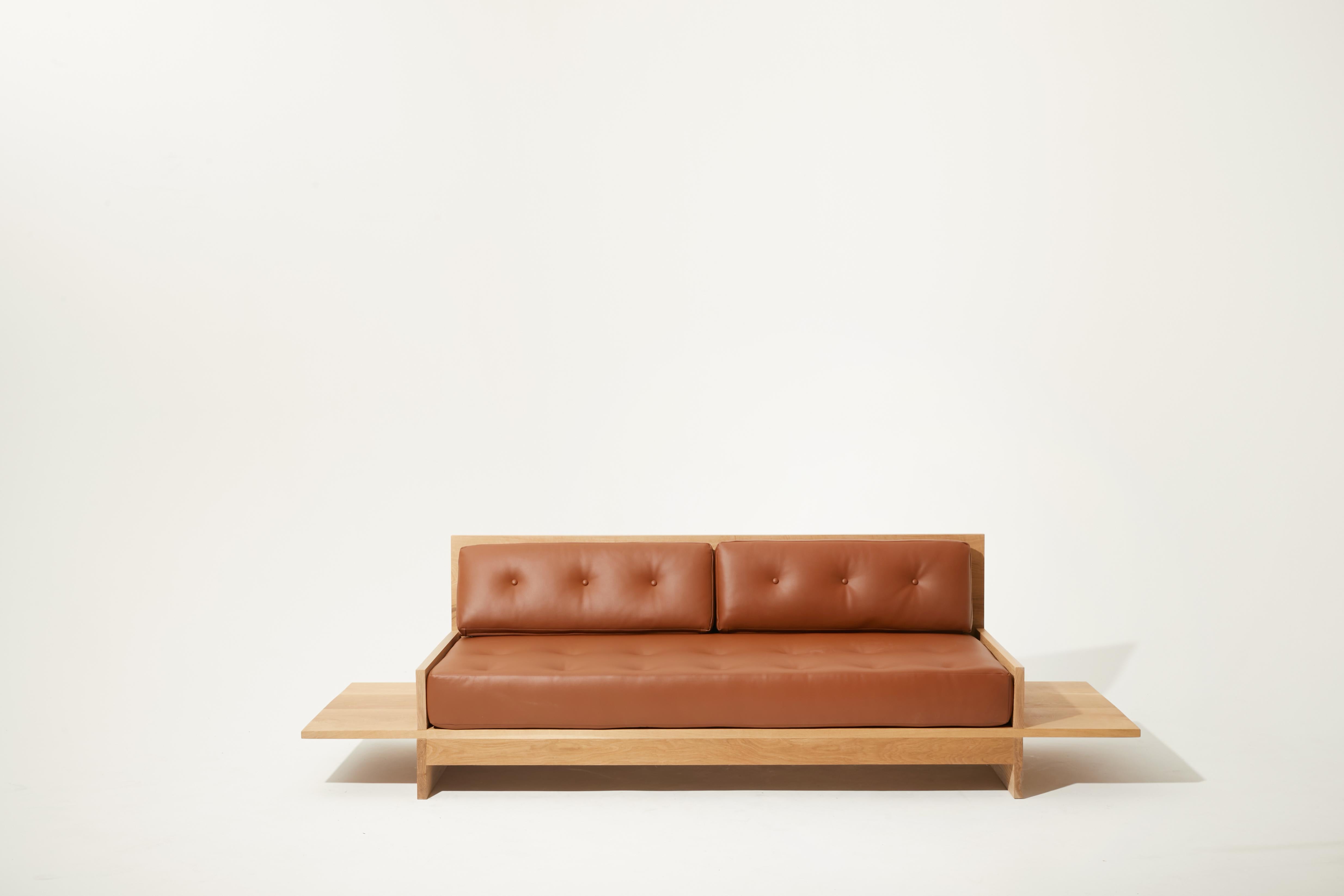 The Restle couch was inspired by a particular afternoon spent at a vintage furniture market in Norway. The 16” side tables on either side of the couch are a hallmark of this design, but I also wanted to refresh the look. It’s made with my signature