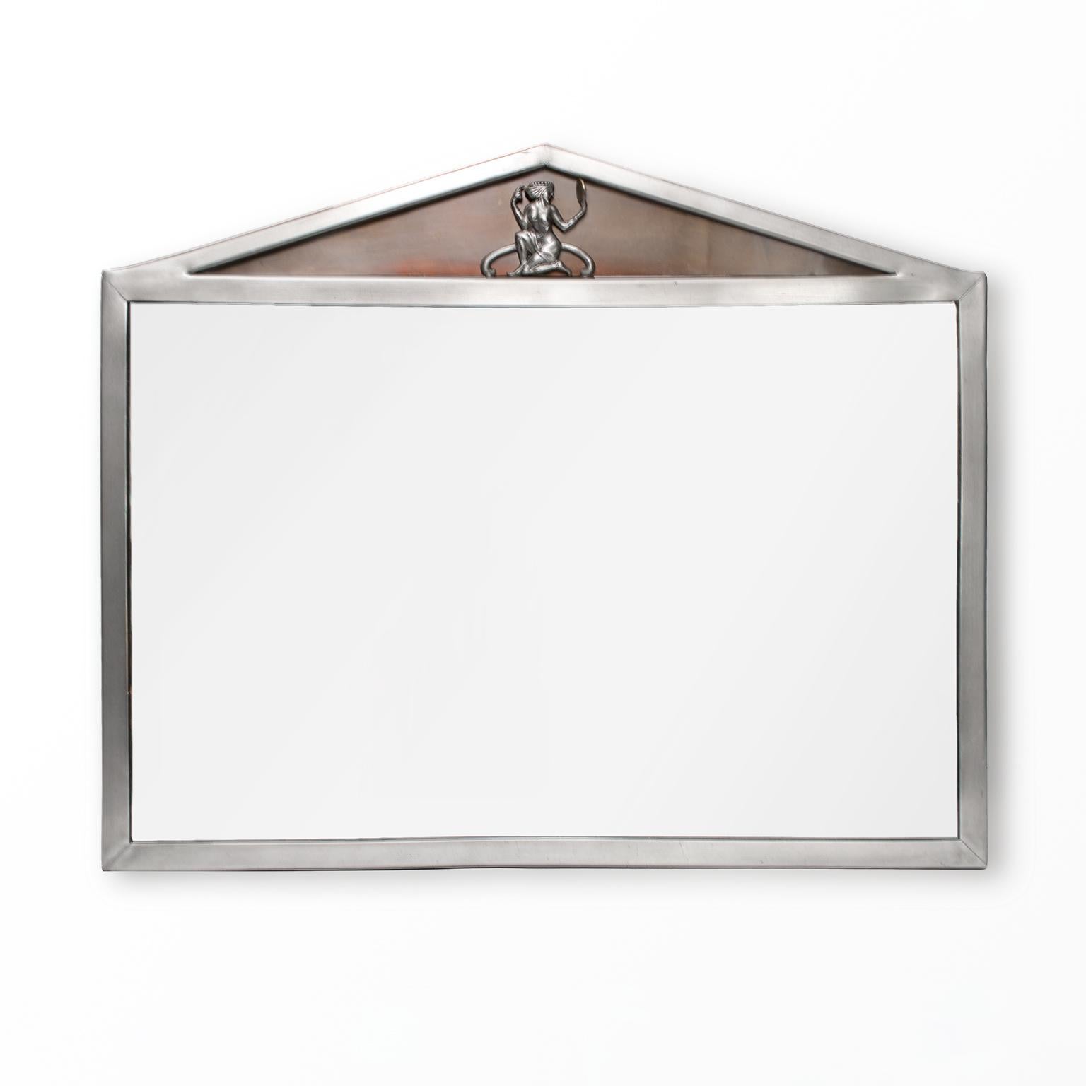 Scandinavian Modern, Swedish Art Deco polished pewter mirror with pediment top which includes a female figure hold a brass mirror. The recessed pediment has a piece of patinated brass. Made by Einar Backstrom, signed on back.

Measures: Height