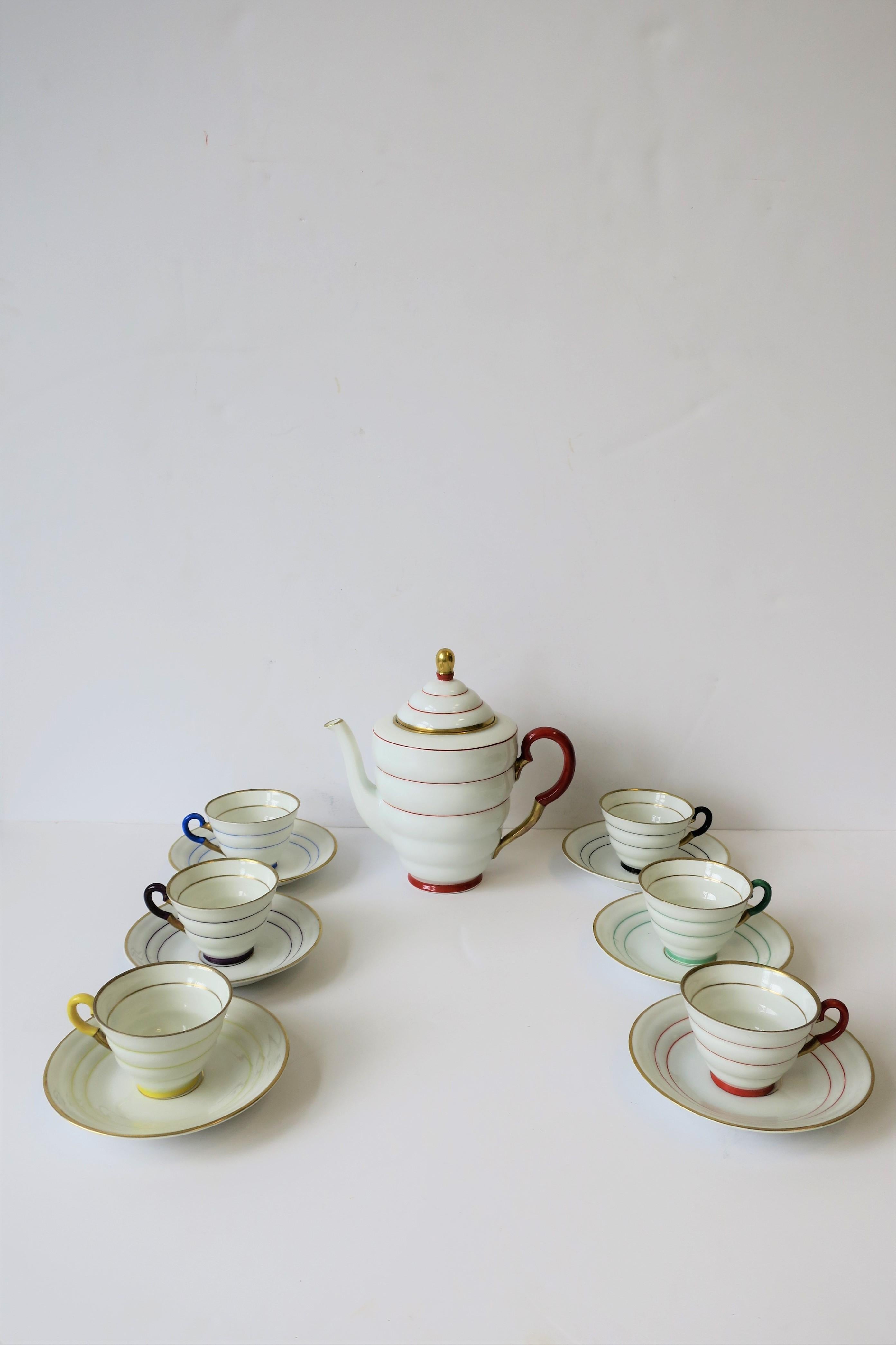 A gorgeous Scandinavian Modern handmade porcelain espresso/coffee or tea demitasse set from Sweden. Beautifully made with six different colors accompanied with gold. Colors include: White porcelain with terracotta/gold, black/gold, emerald