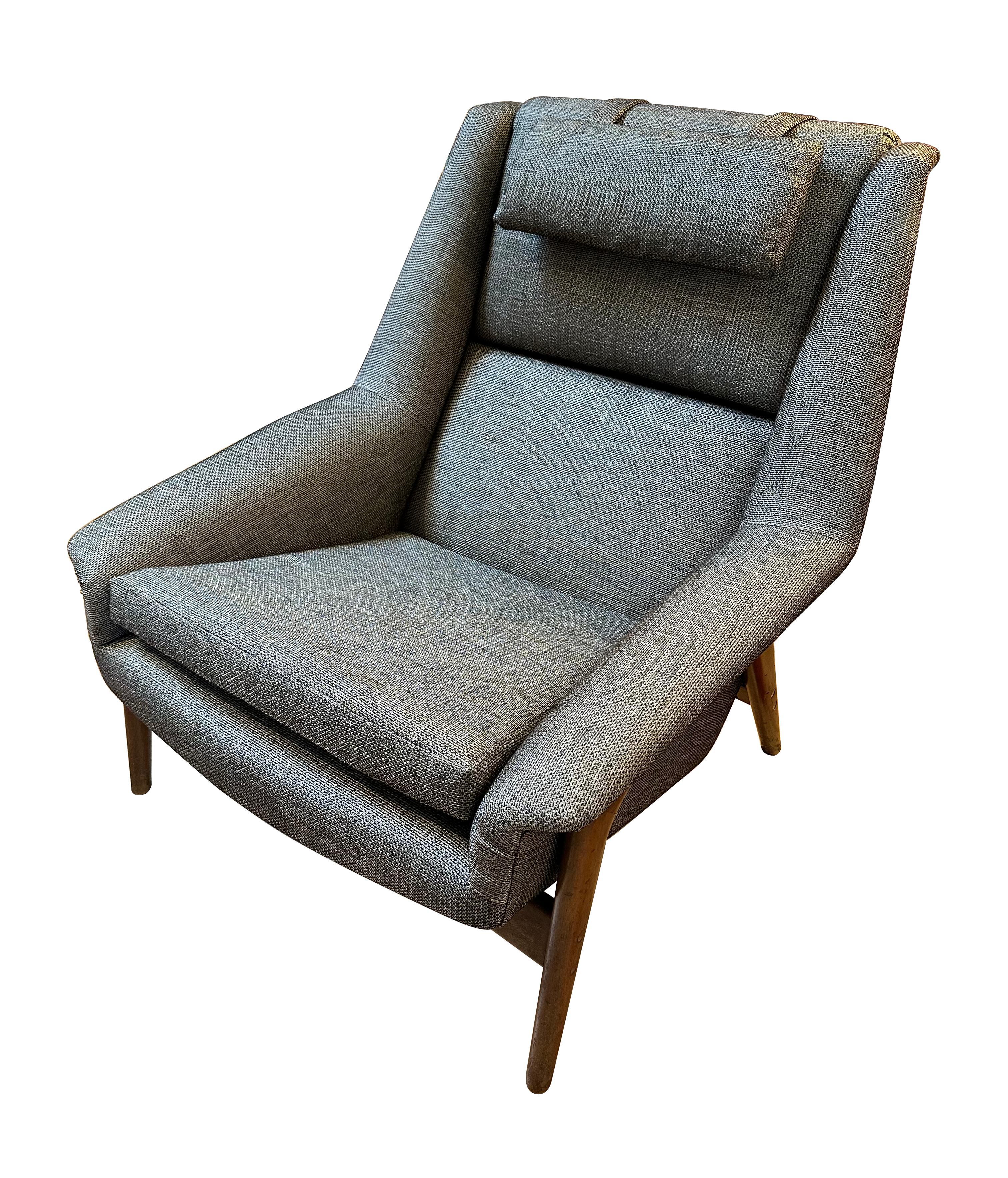 1960s Scandinavian Modern Profil lounge chair designed by Folke Ohlsson for Dux Sweden. The chair has been professionally reupholstered with new material, and has a removeable headrest. The chair is fully upholstered with a teak frame. In excellent