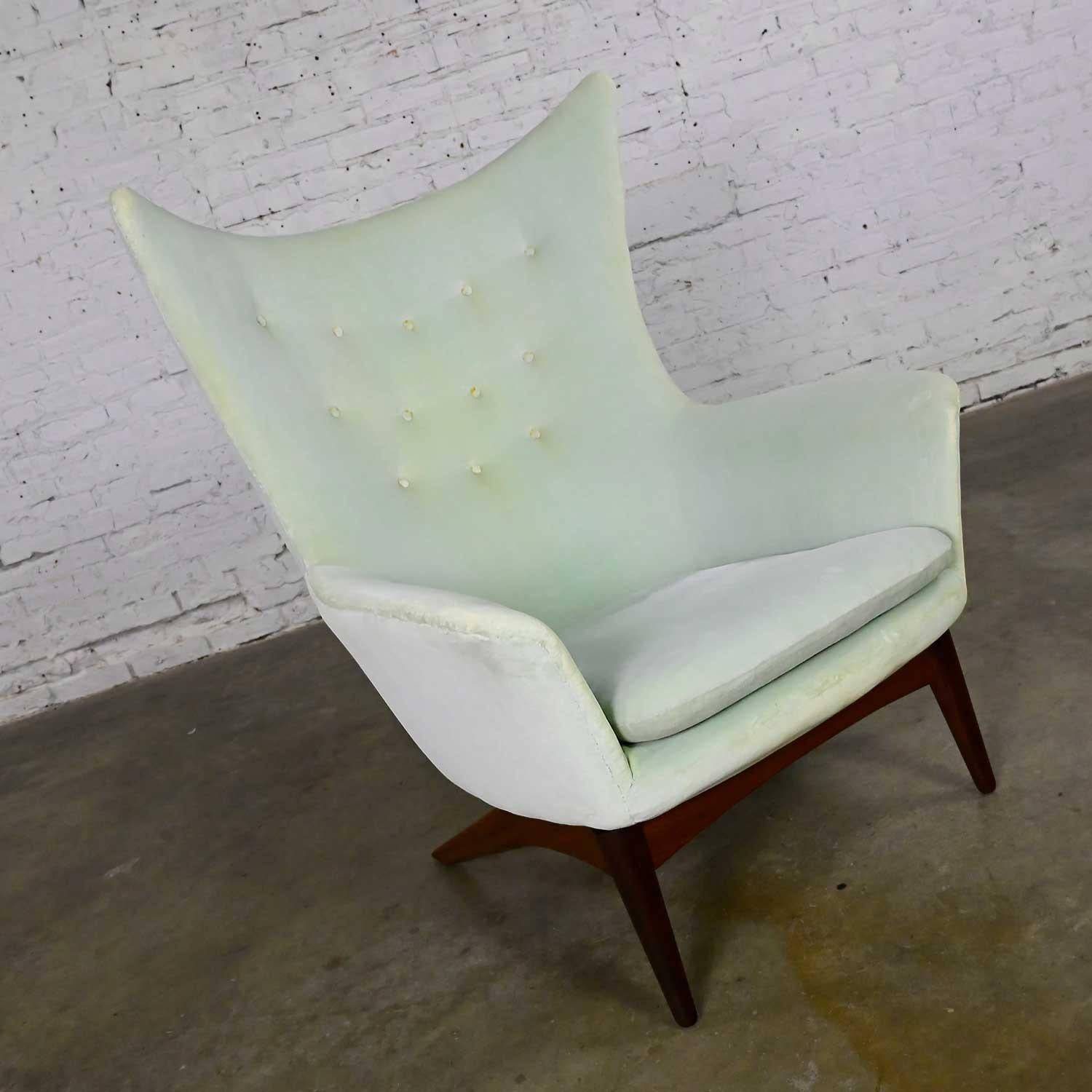 Wonderful vintage Scandinavian Modern reclining wingback lounge chair by H.W. Klein for Bramin Mobler. Comprised of a teak frame, pressured reclining mechanism, and light mint green upholstery. Beautiful condition, keeping in mind that this is