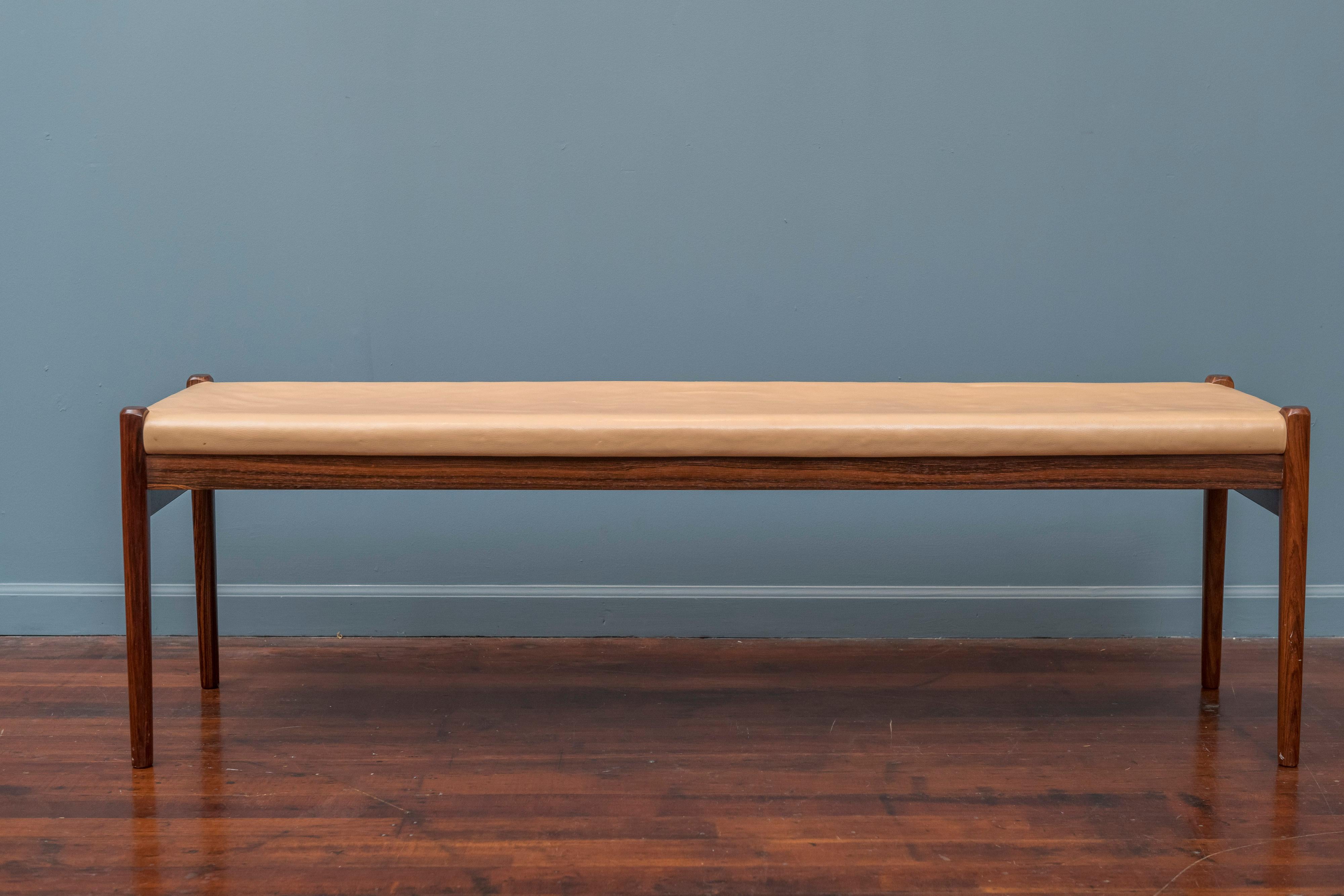 Scandinavian modern rosewood and leather bench by Niels Moller, Model 63. Good original condition with a small dent on top of one leg and leather has wear conminsurate with age and use.