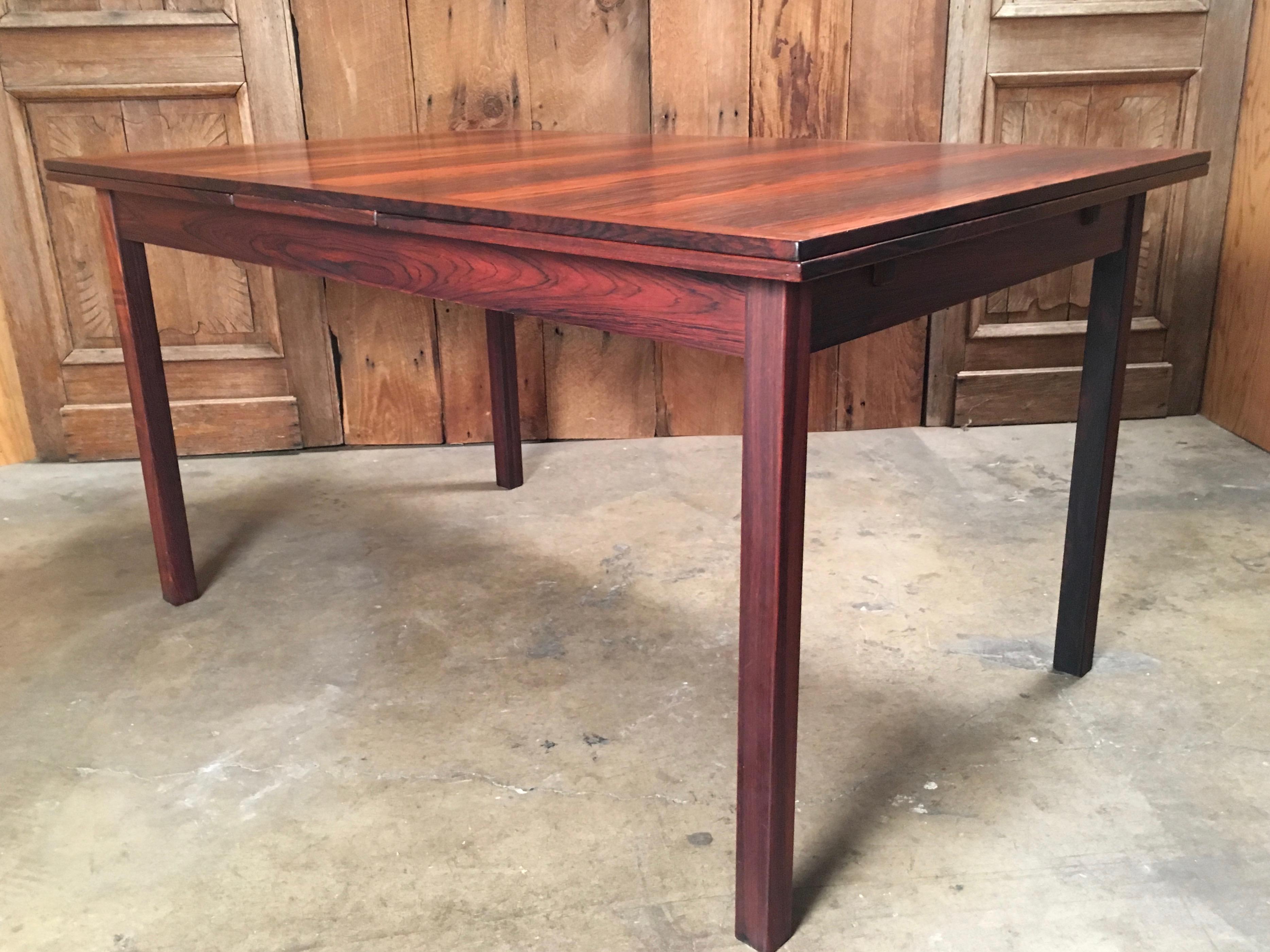 Rosewood draw-leaf table 
The table is 55