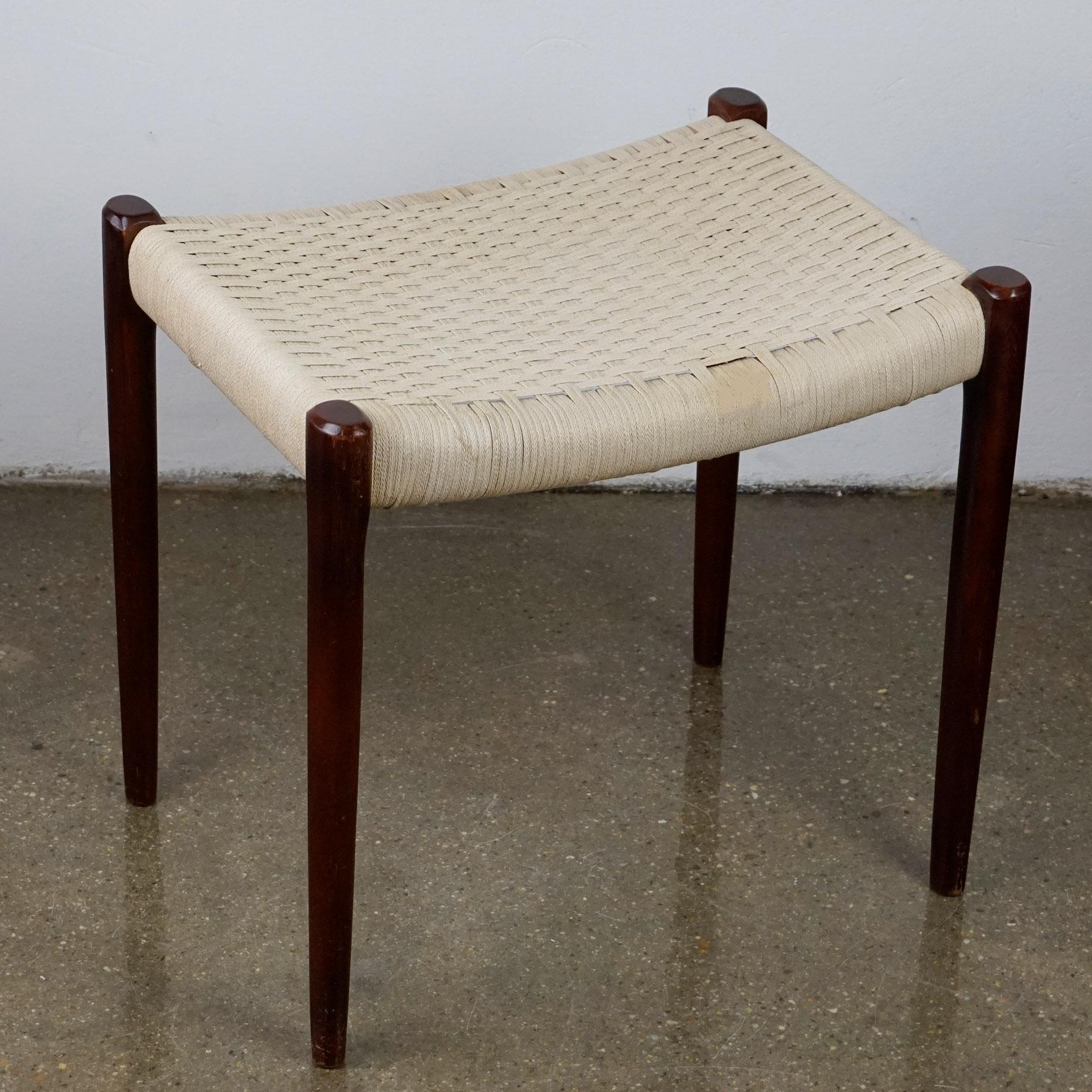 Beautiful and rare Niels O. Moller rosewood stool from the 1960s, model 80A for J.L. Moller, Denmark. Fantastic Danish modern design, great condition. The seat is still original and is made of flat-woven cord of wool string. Due to its age it shows