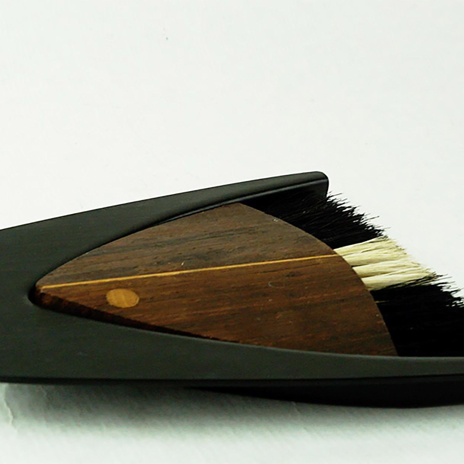 This amazing Danish midcentury rosewood fish shaped crumb sweeper or table brush was designed by Laurids Lonborg.
It features graphical pure design and excellent handcrafted inlays in beautiful condition.

 