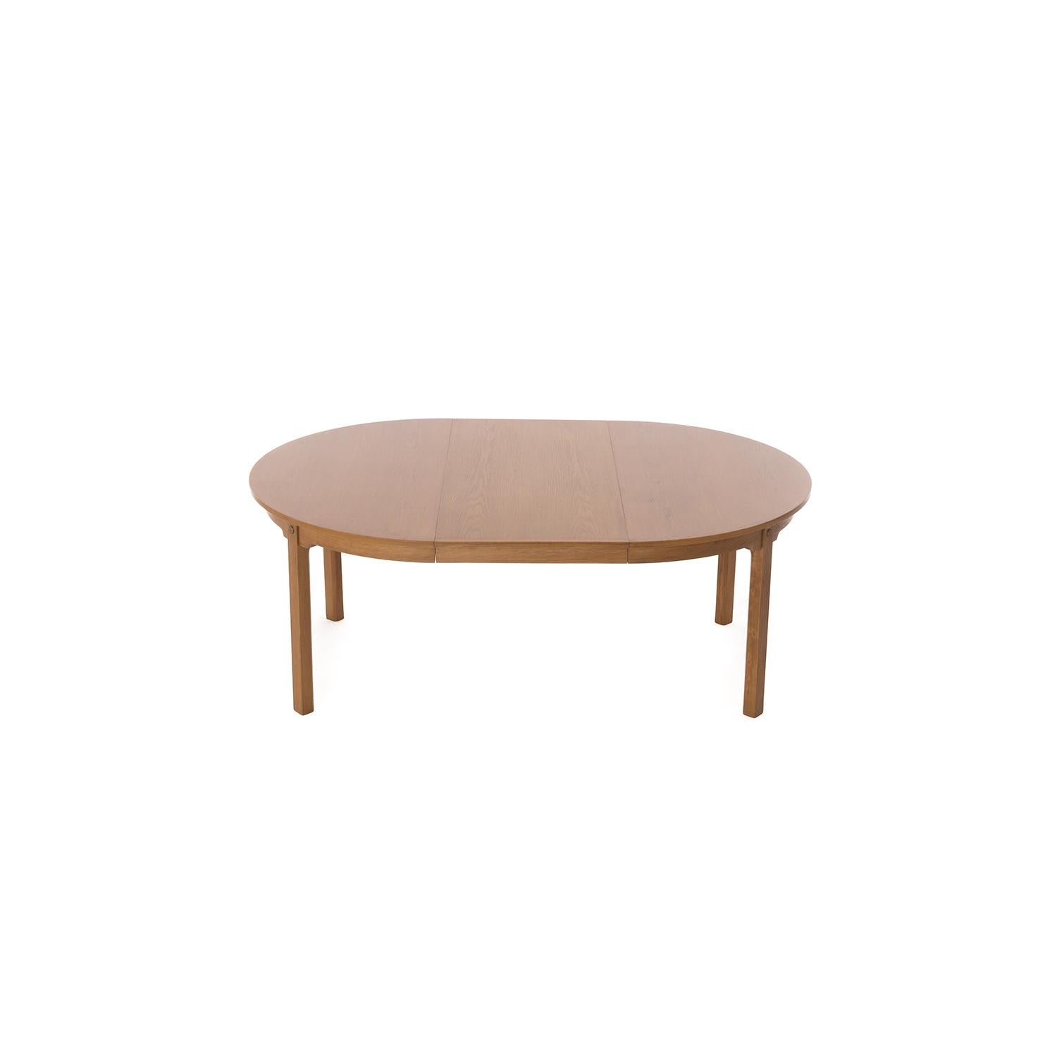 Scandinavian Modern Round to Oval Oak Dining Table with Brass Detail 1