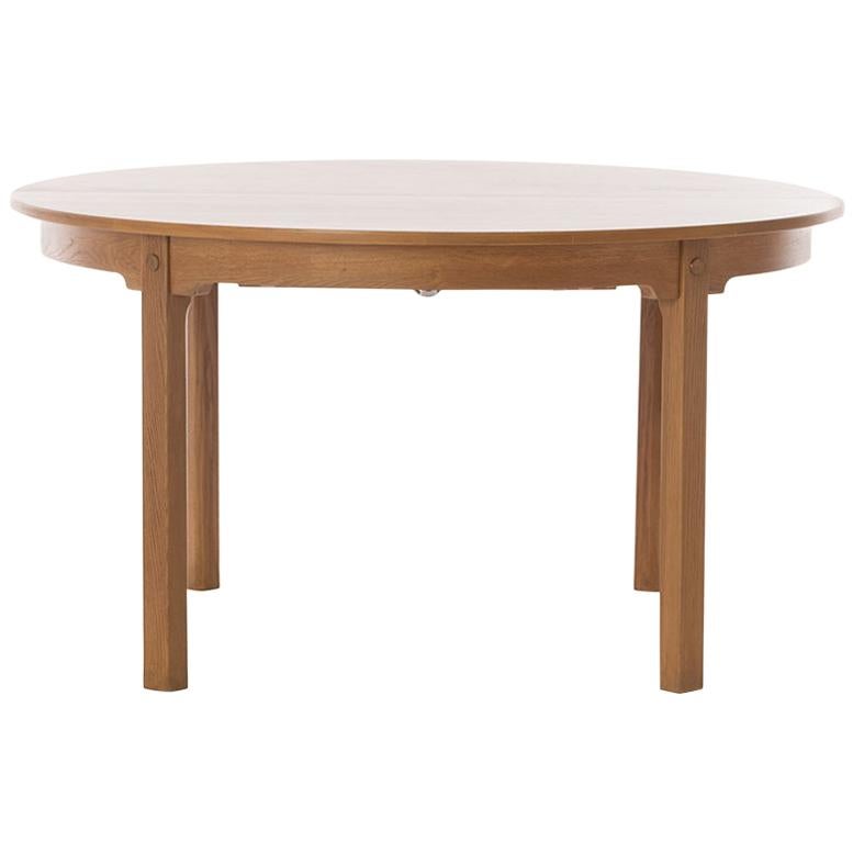 Scandinavian Modern Round to Oval Oak Dining Table with Brass Detail